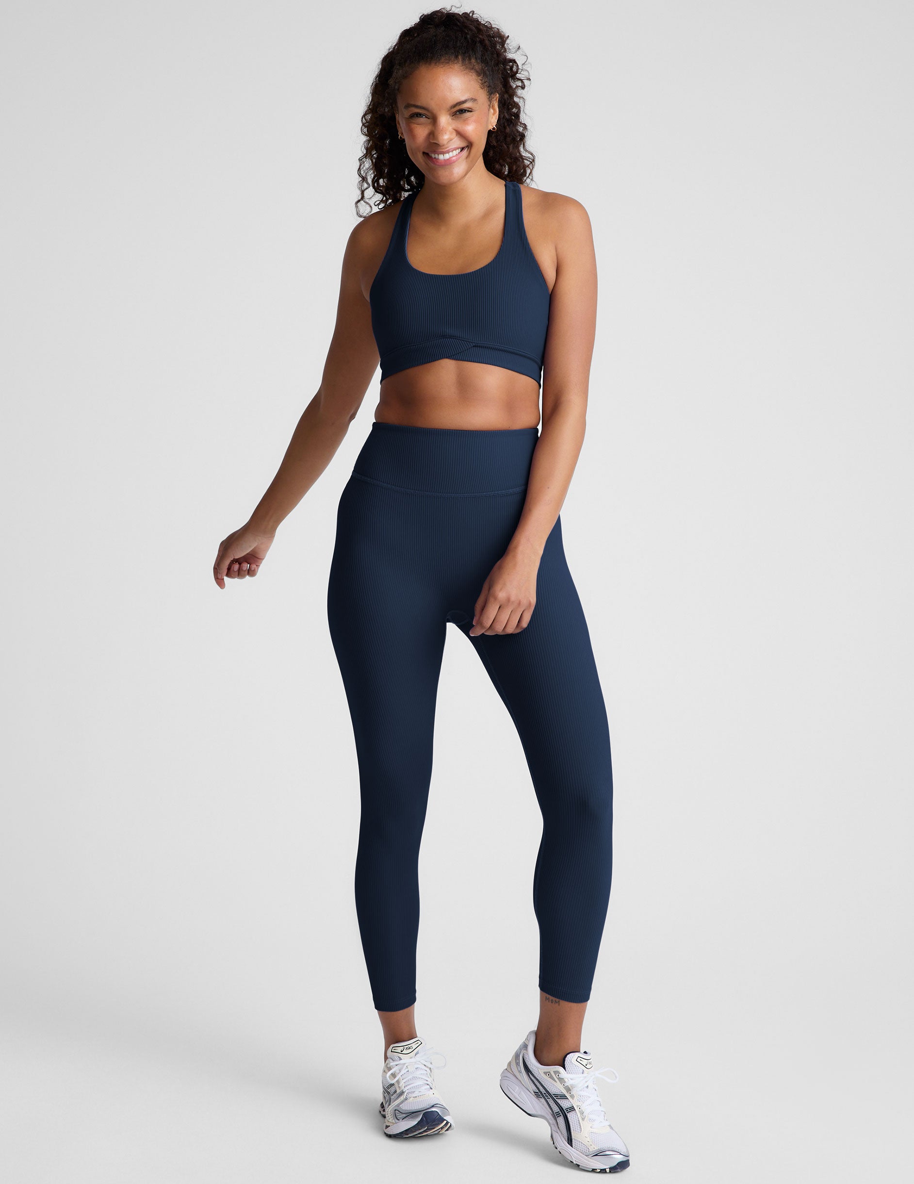 blue racerback bra with a scoop neckline
and overlapping hemband detail.