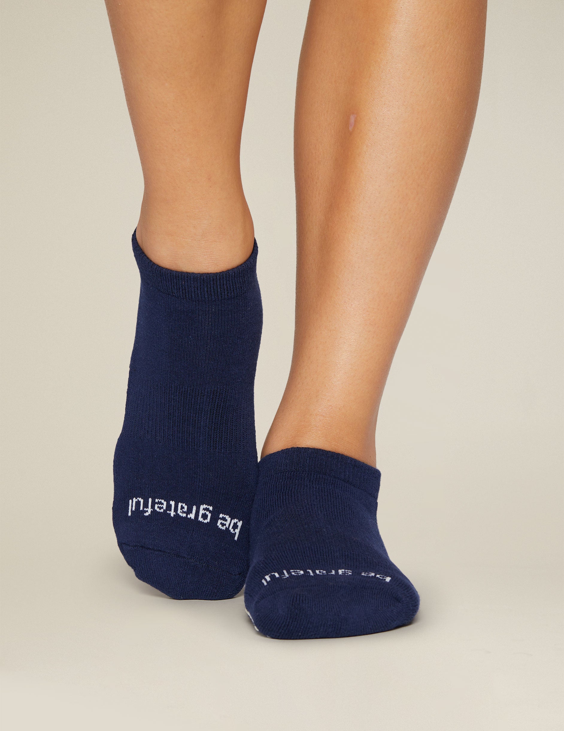 blue ankle length grip socks. 