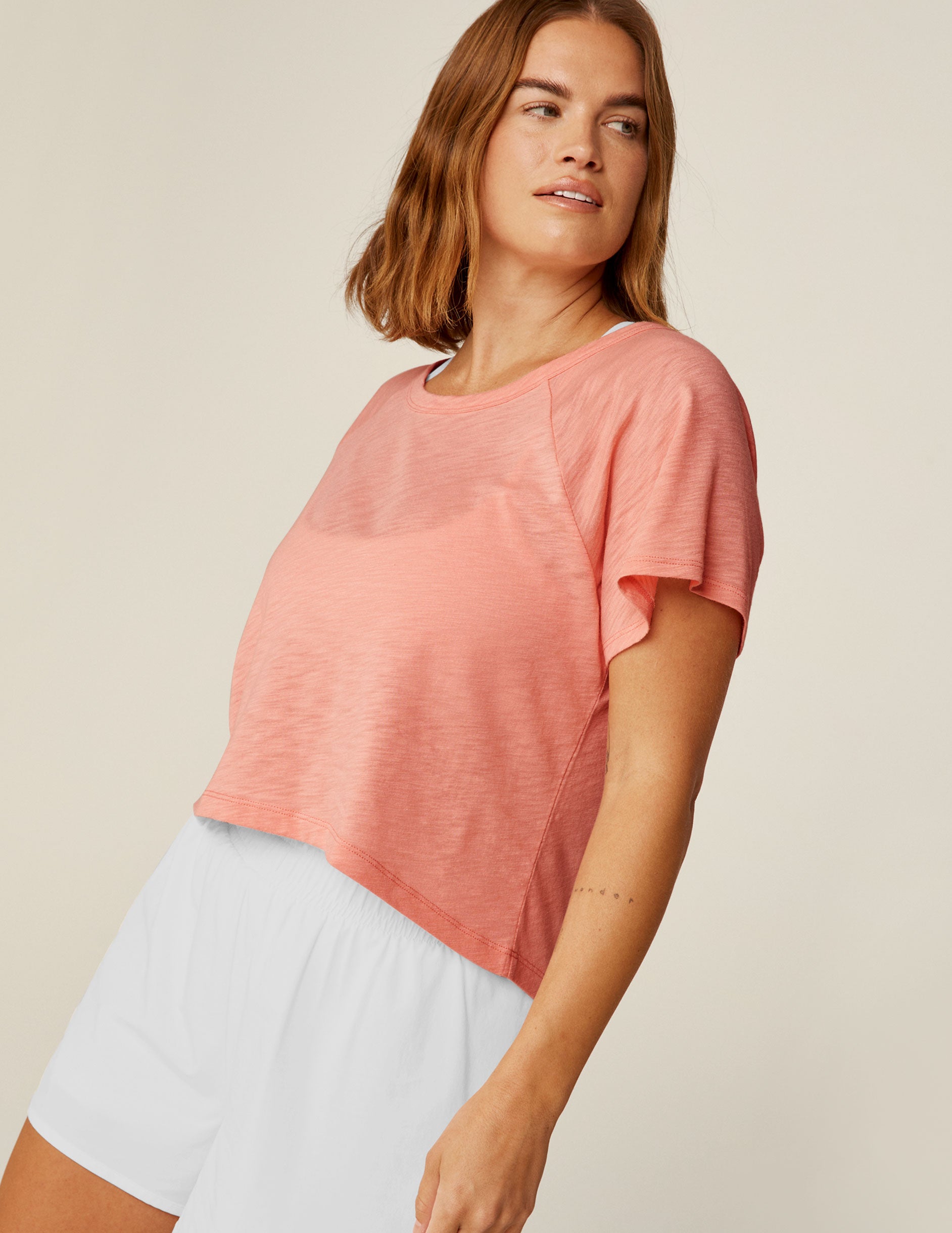 pink v-neck high-low cropped top.