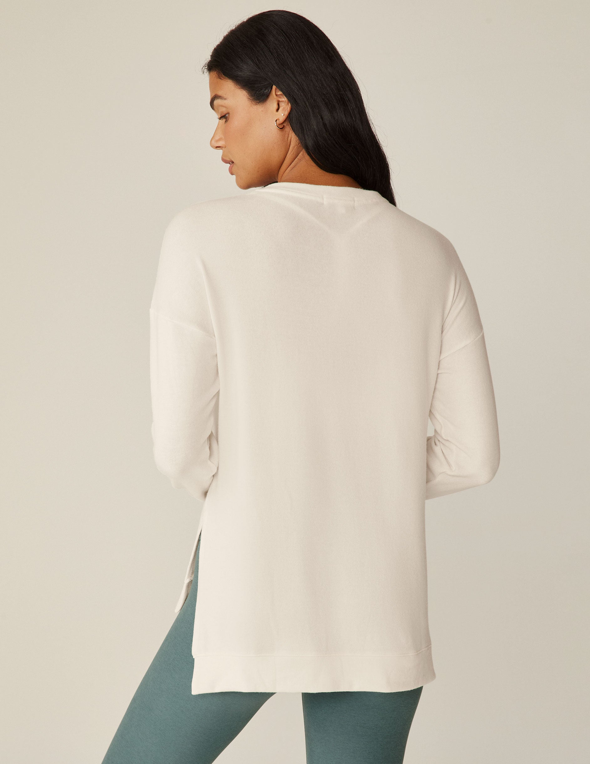 white v-neck pullover sweater with a high low hem.