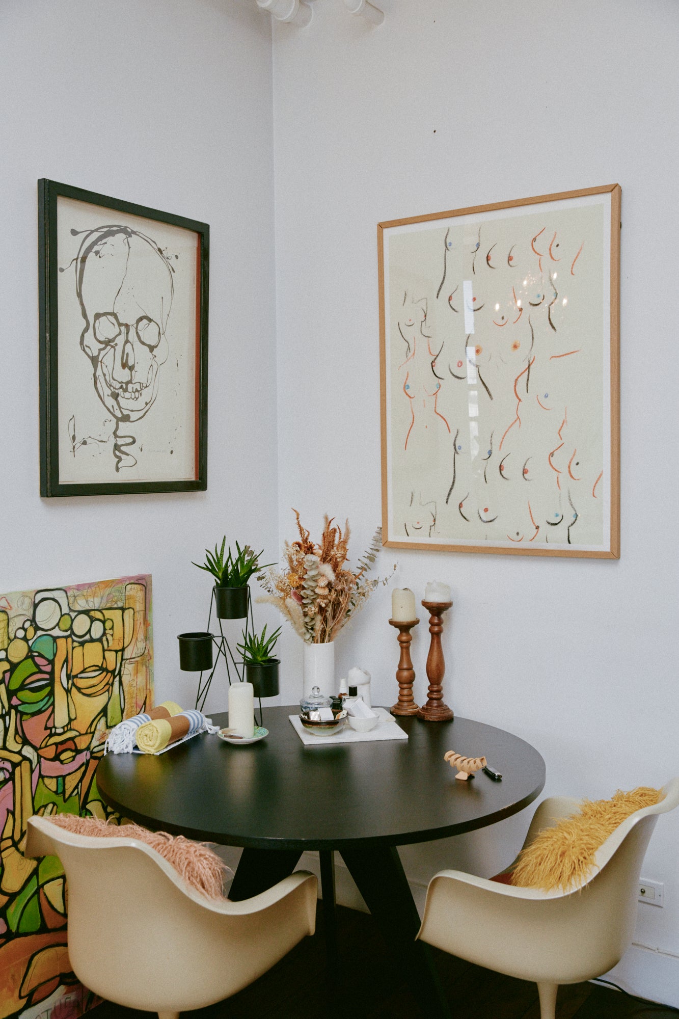 Claire's table with artwork hanging above