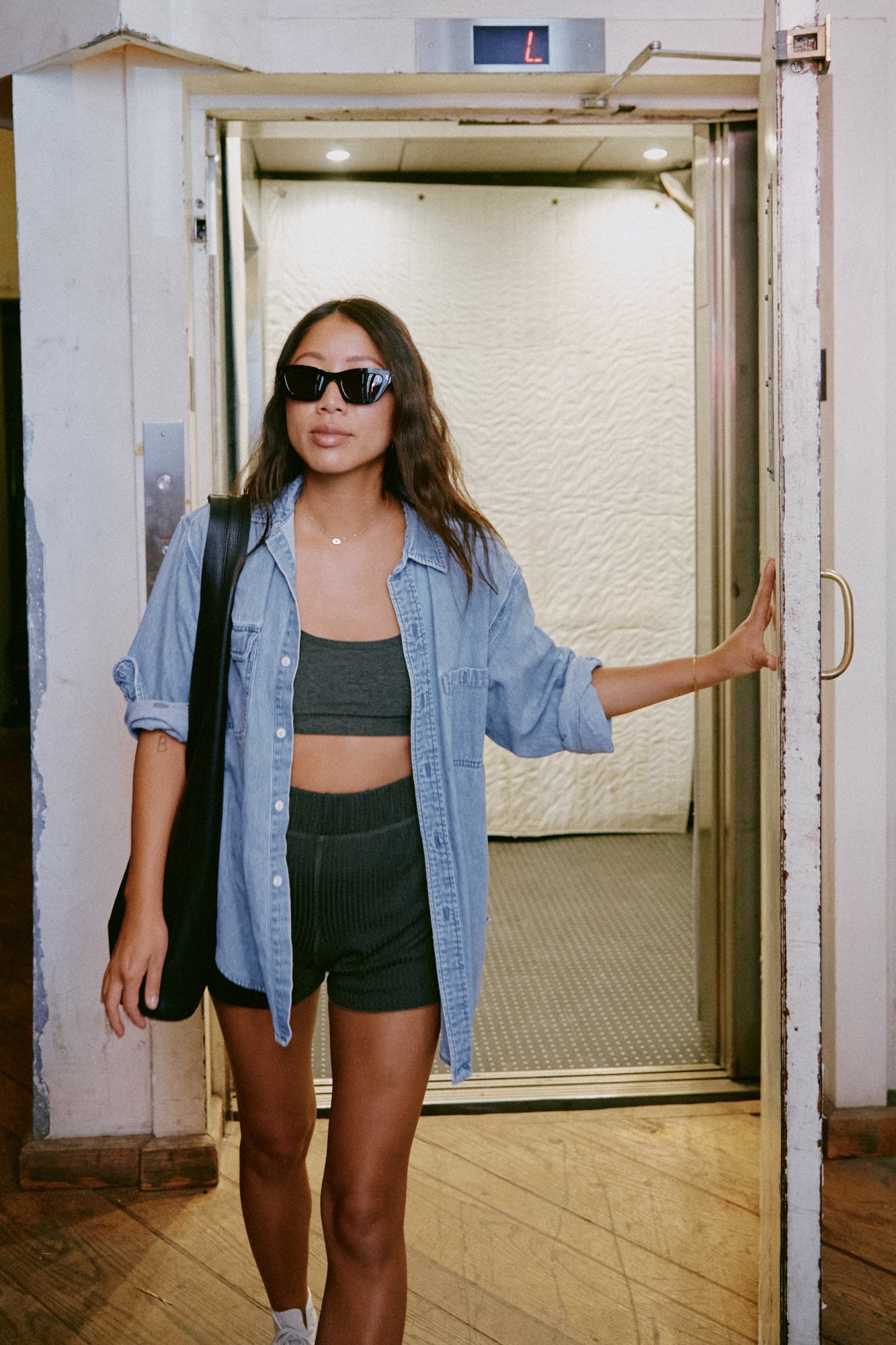 Claire exiting her building
