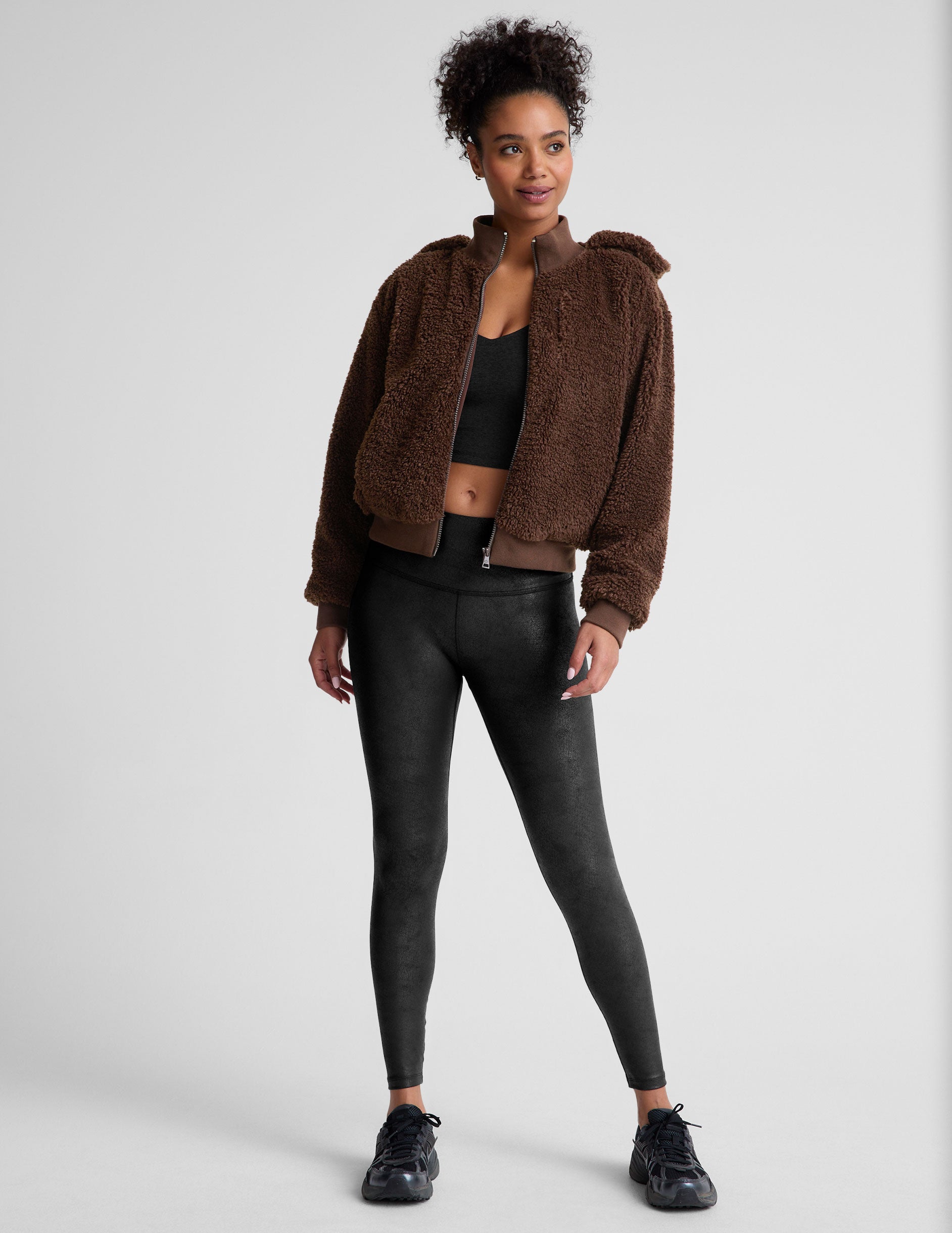black leather high-waisted midi leggings.