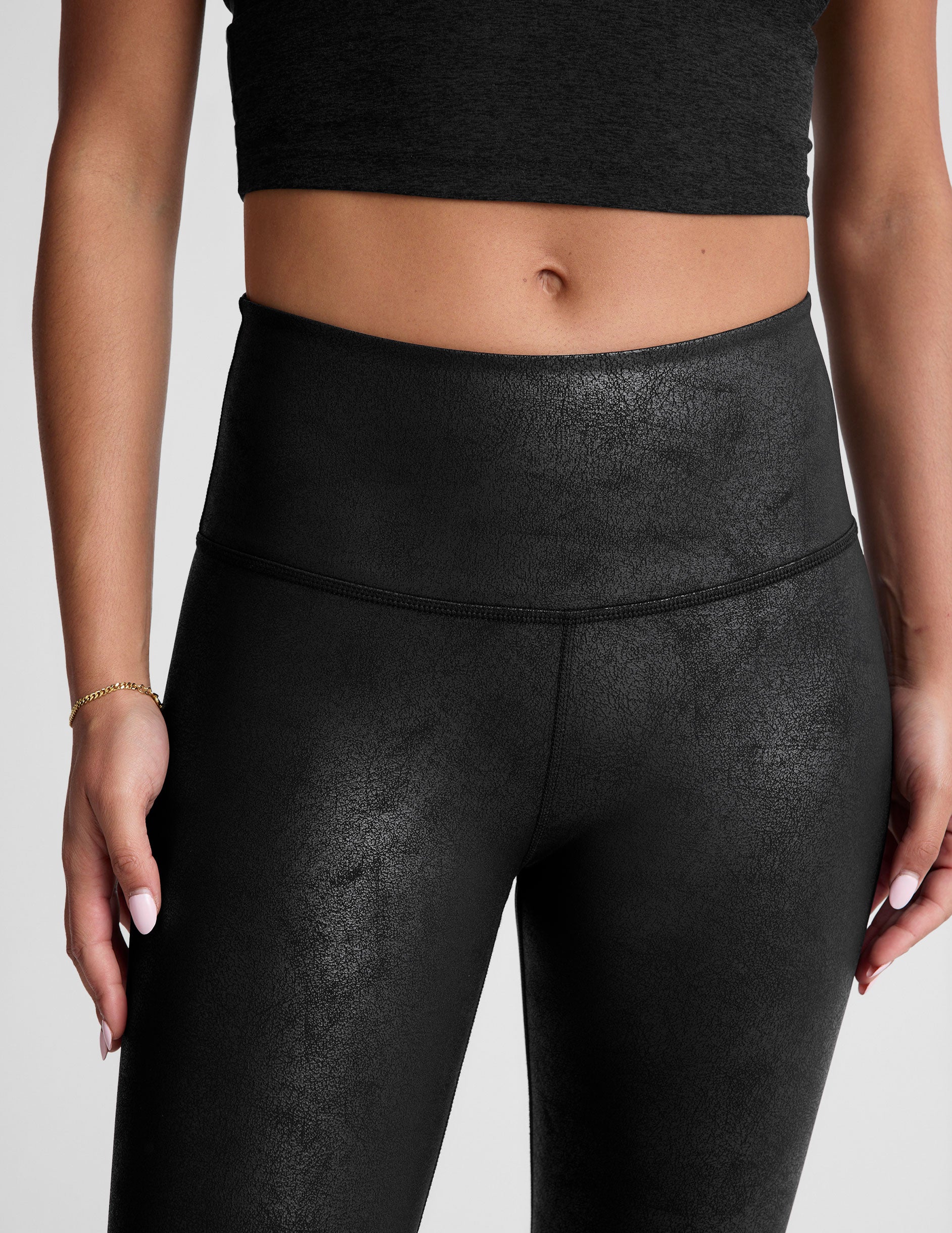 black leather high-waisted midi leggings.