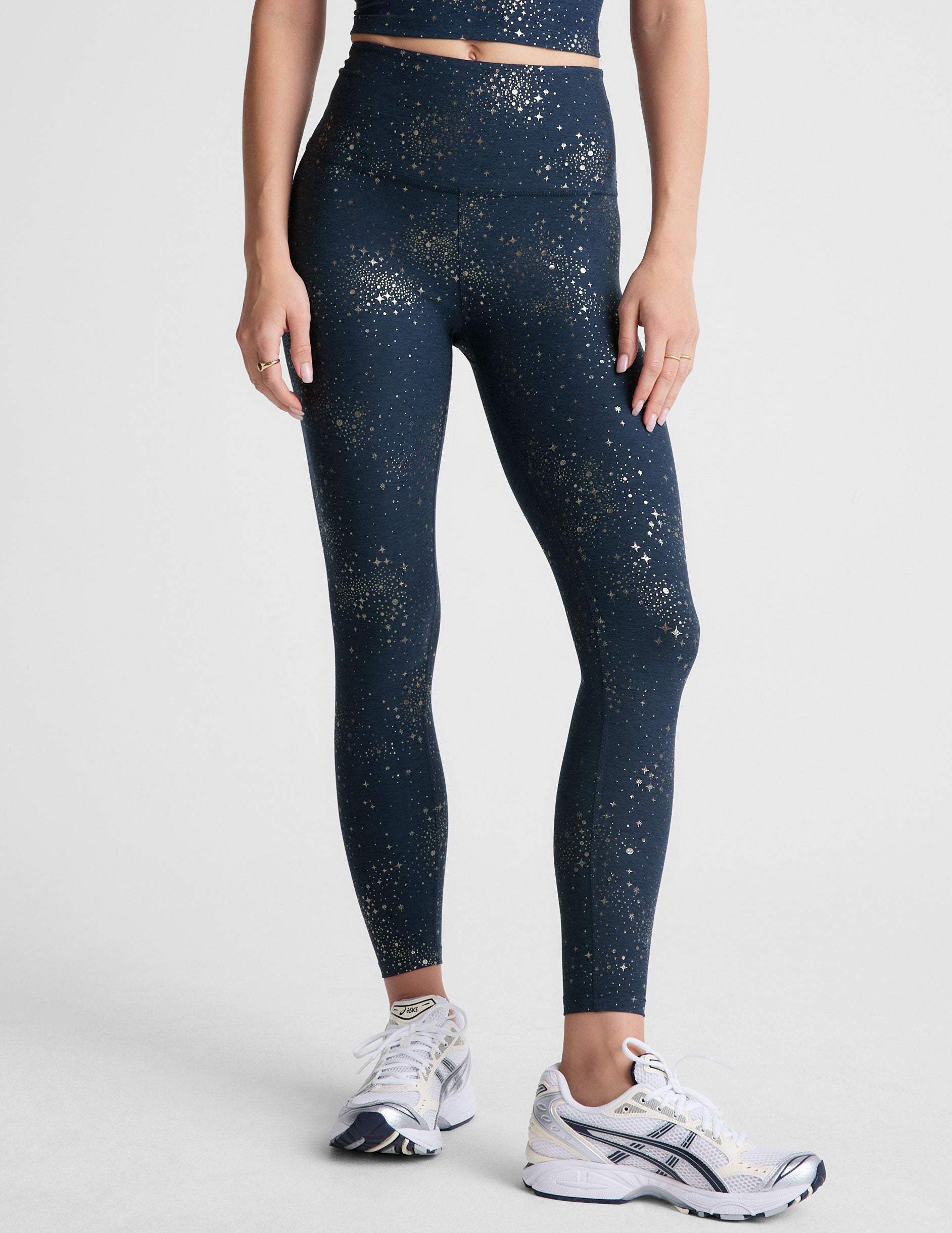 blue high-waisted midi leggings with a star foil print.
