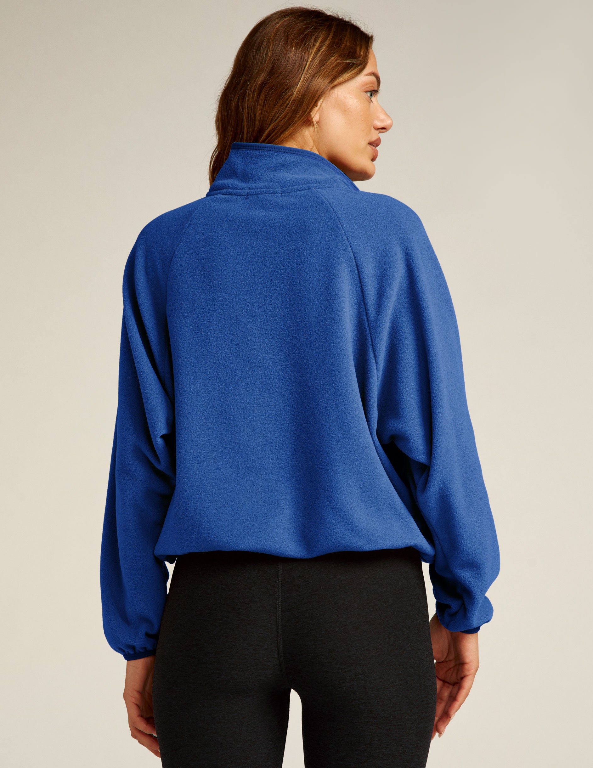 blue quarter button fleece pullover with a kangaroo front pocket. 
