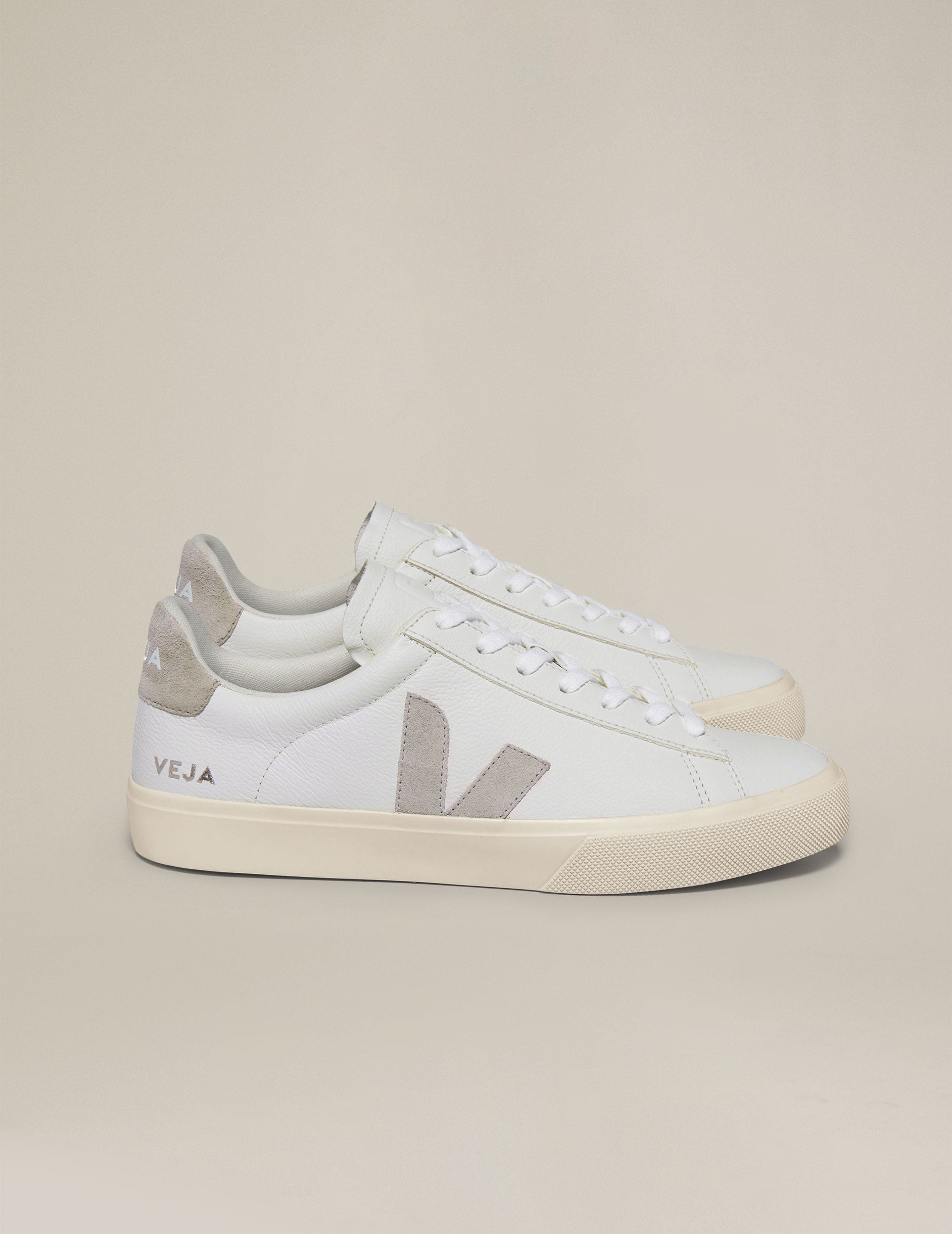 white and tan Veja sneakers.