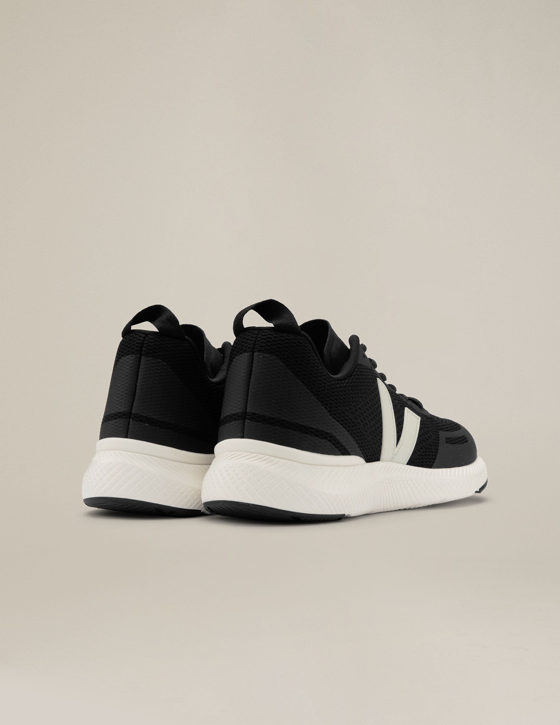 black and white Veja Impala running shoes. made in Brazil.