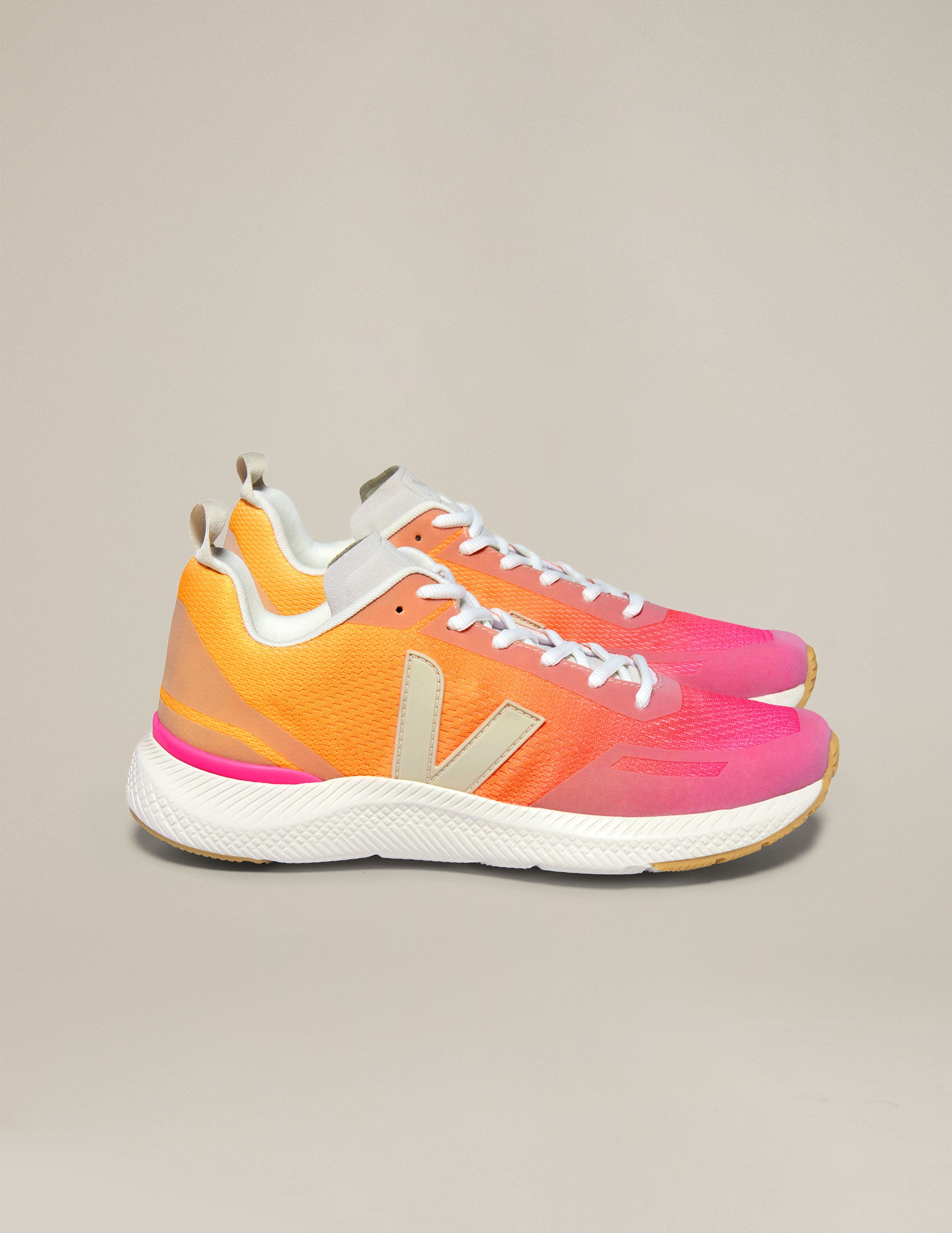 orange and pink lace up sneakers from Veja.