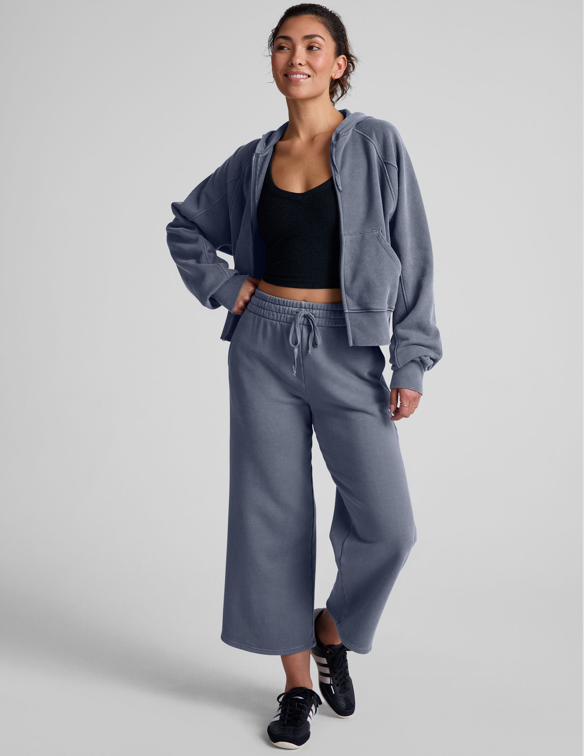 blue zip-up jacket with pockets and a hoodie.