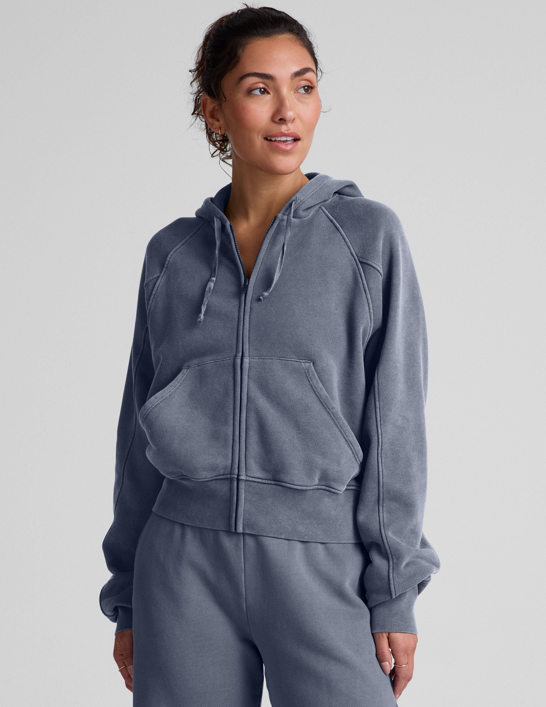 blue zip-up jacket with pockets and a hoodie.