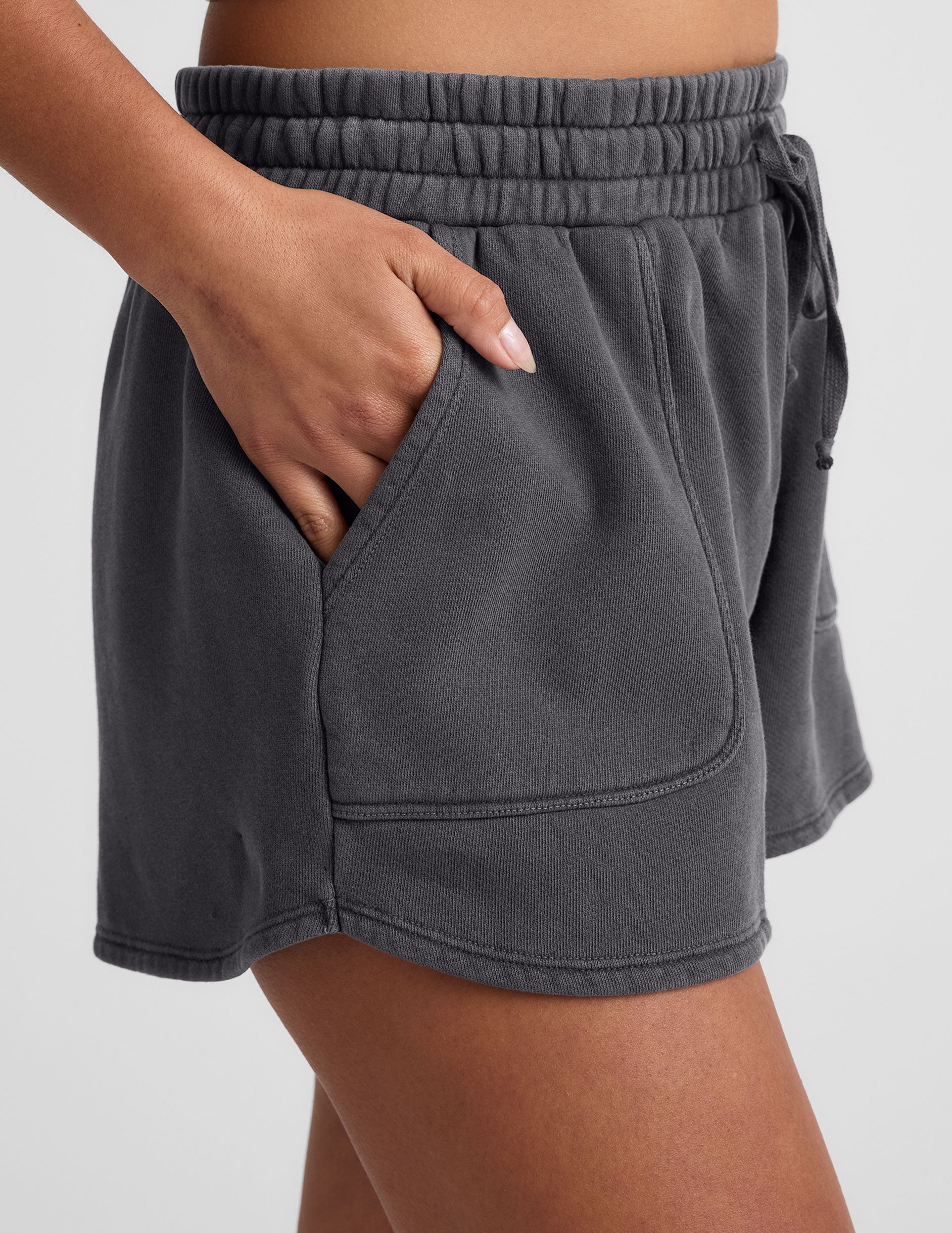 black shorts with patch pockets and a drawstring at waistband.