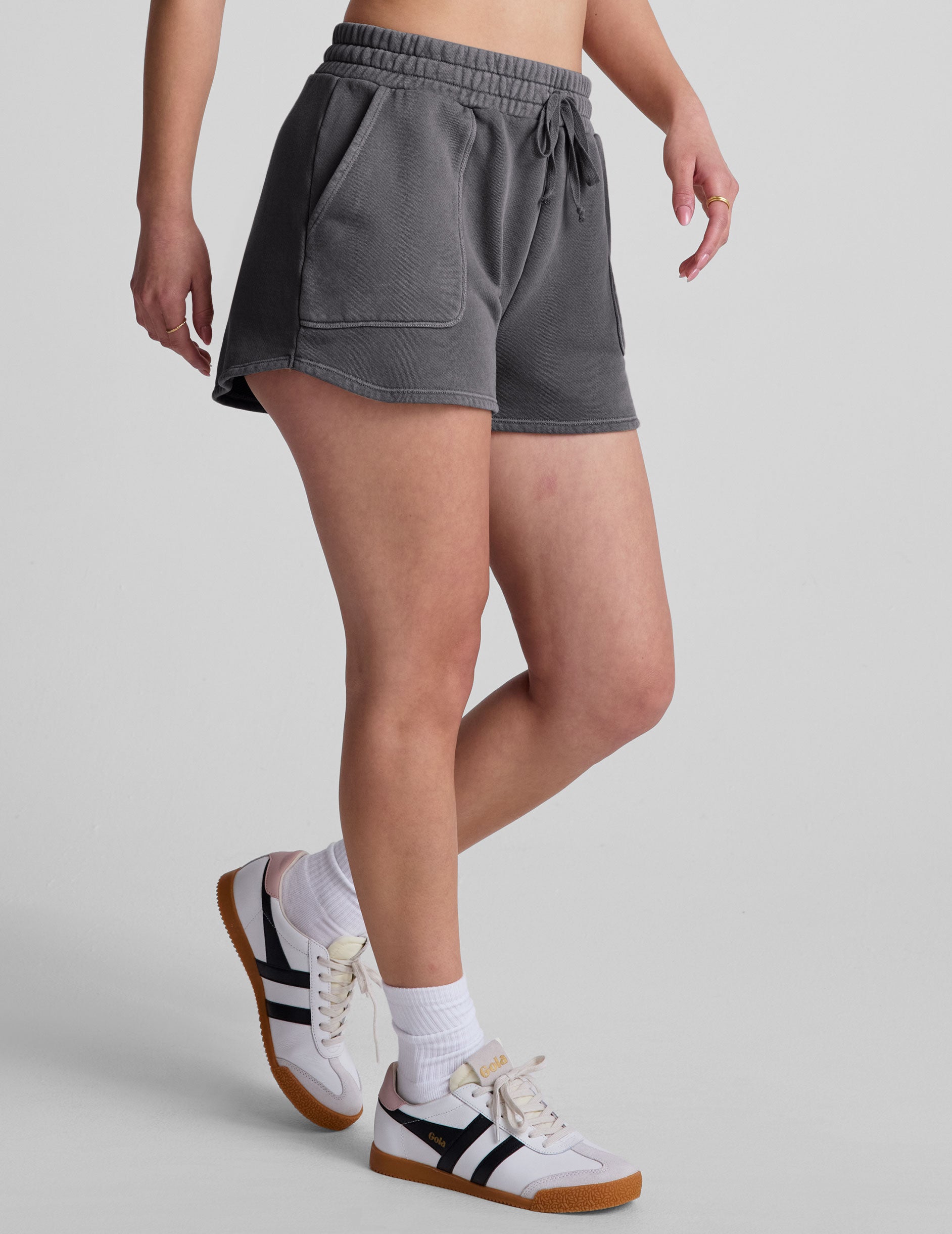 black shorts with patch pockets and a drawstring at waistband.