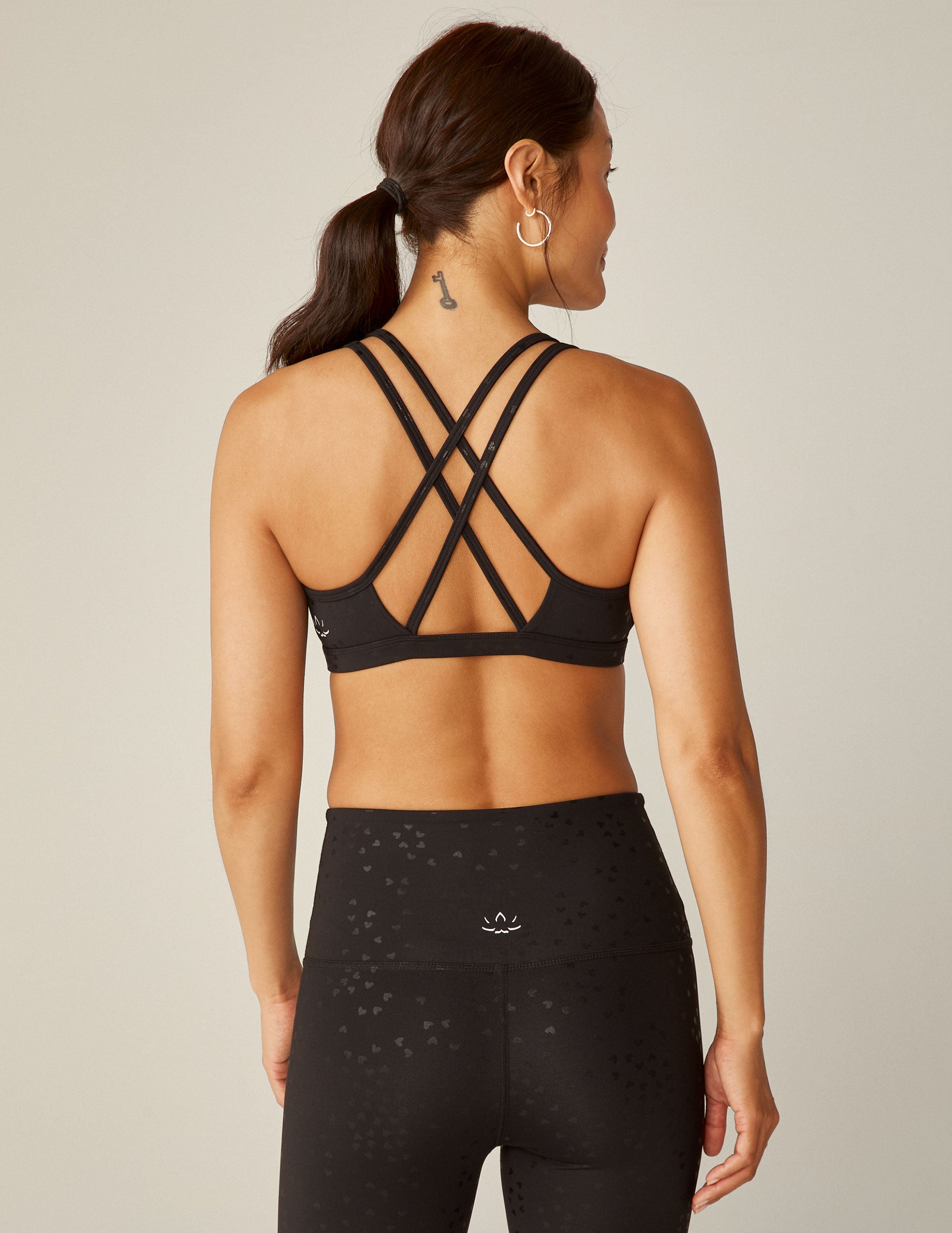 black heart printed double-strapped with a back crossover design sports bra. 