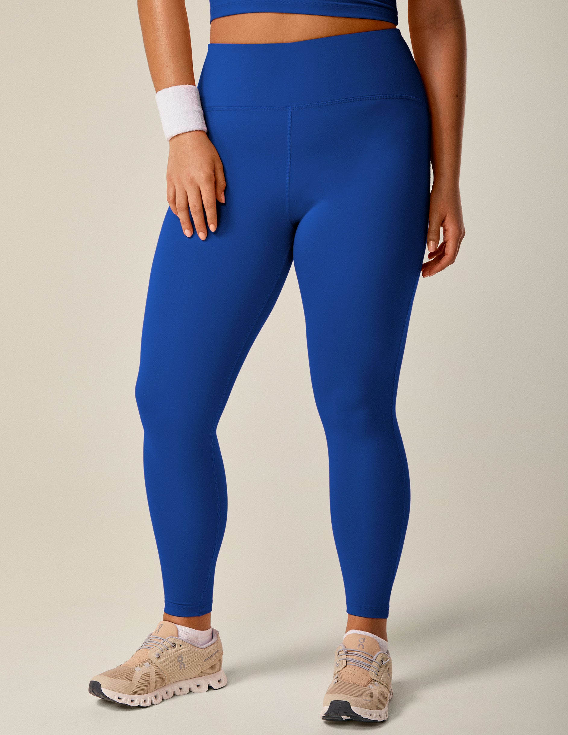 blue 4" high-waisted midi PowerBeyond leggings. 