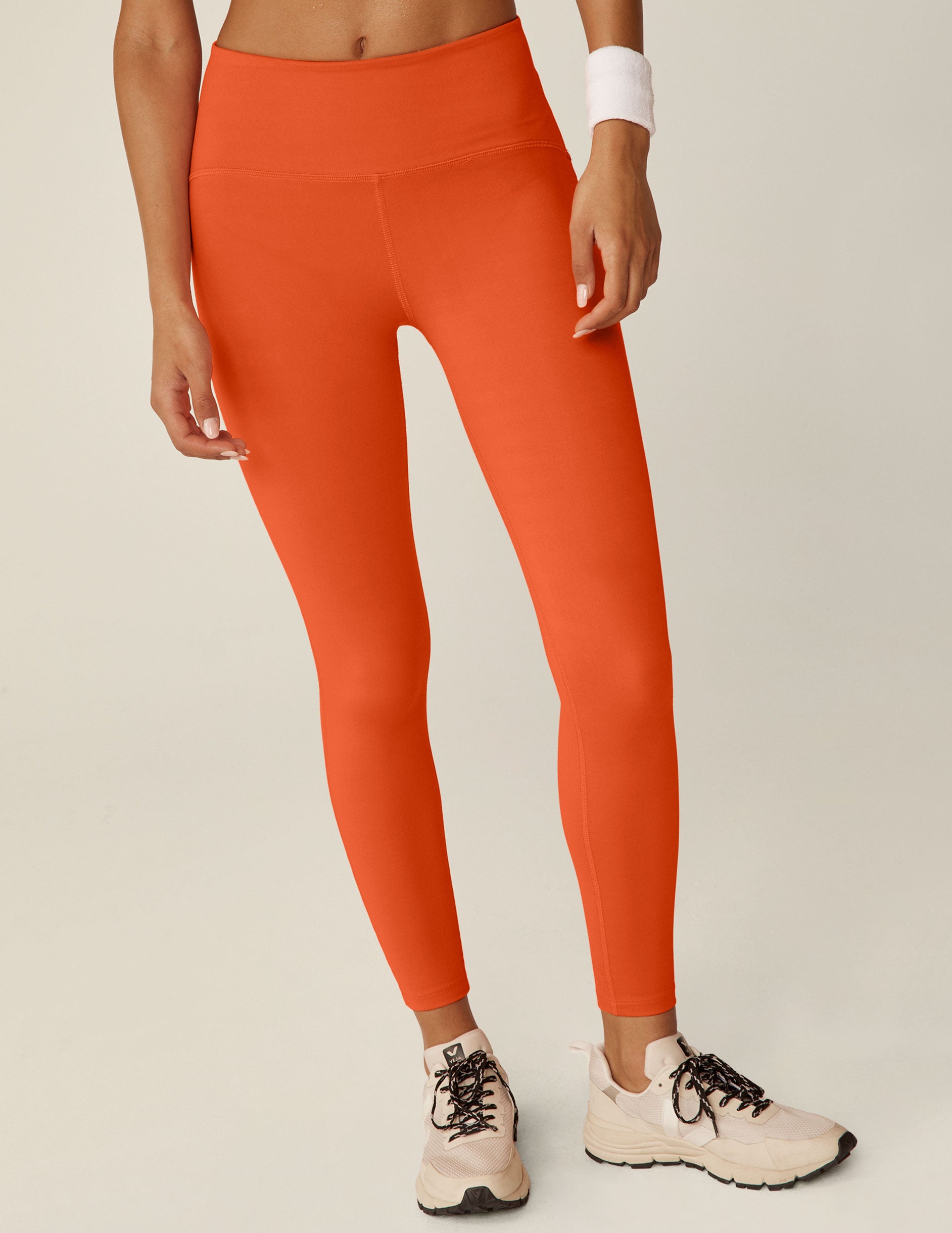 orange POWERBEYOND midi leggings. 