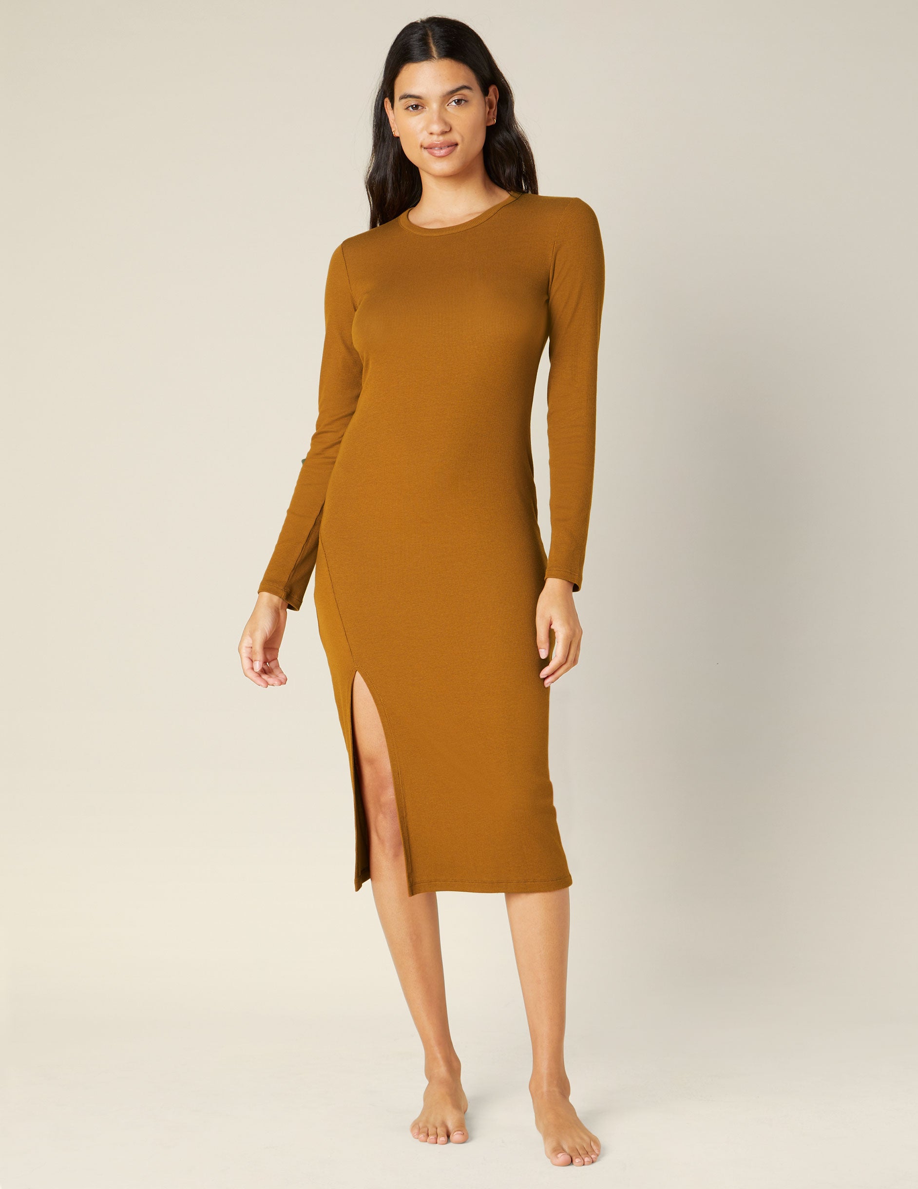 brown long sleeve midi dress with a front side slit. 
