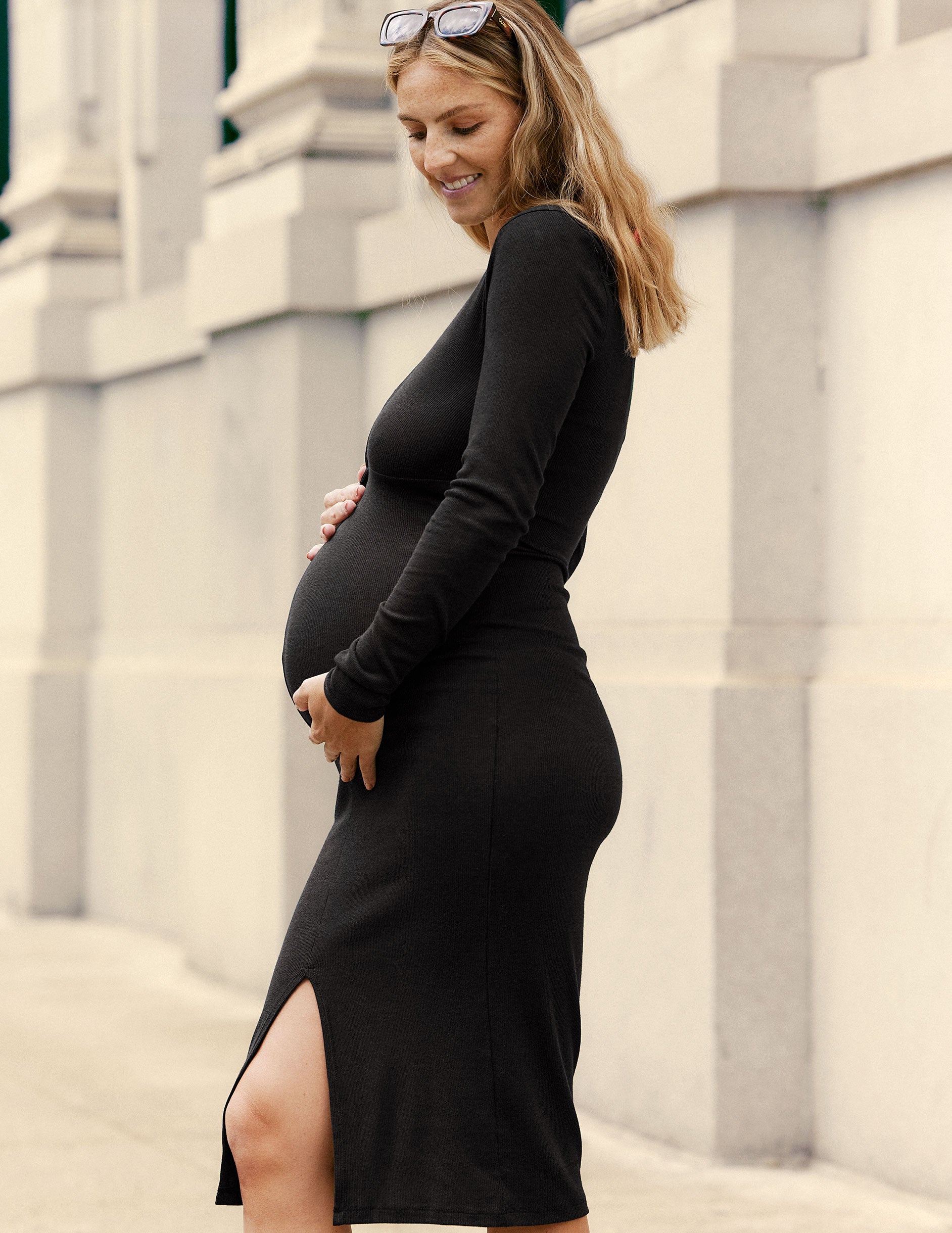 black maternity midi dress with a twist design and front side slit.