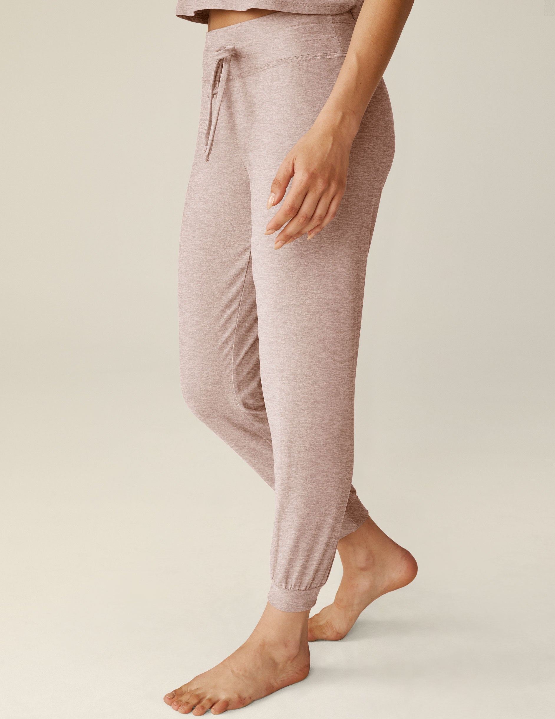 beige midi joggers with a drawstring at waistband. 