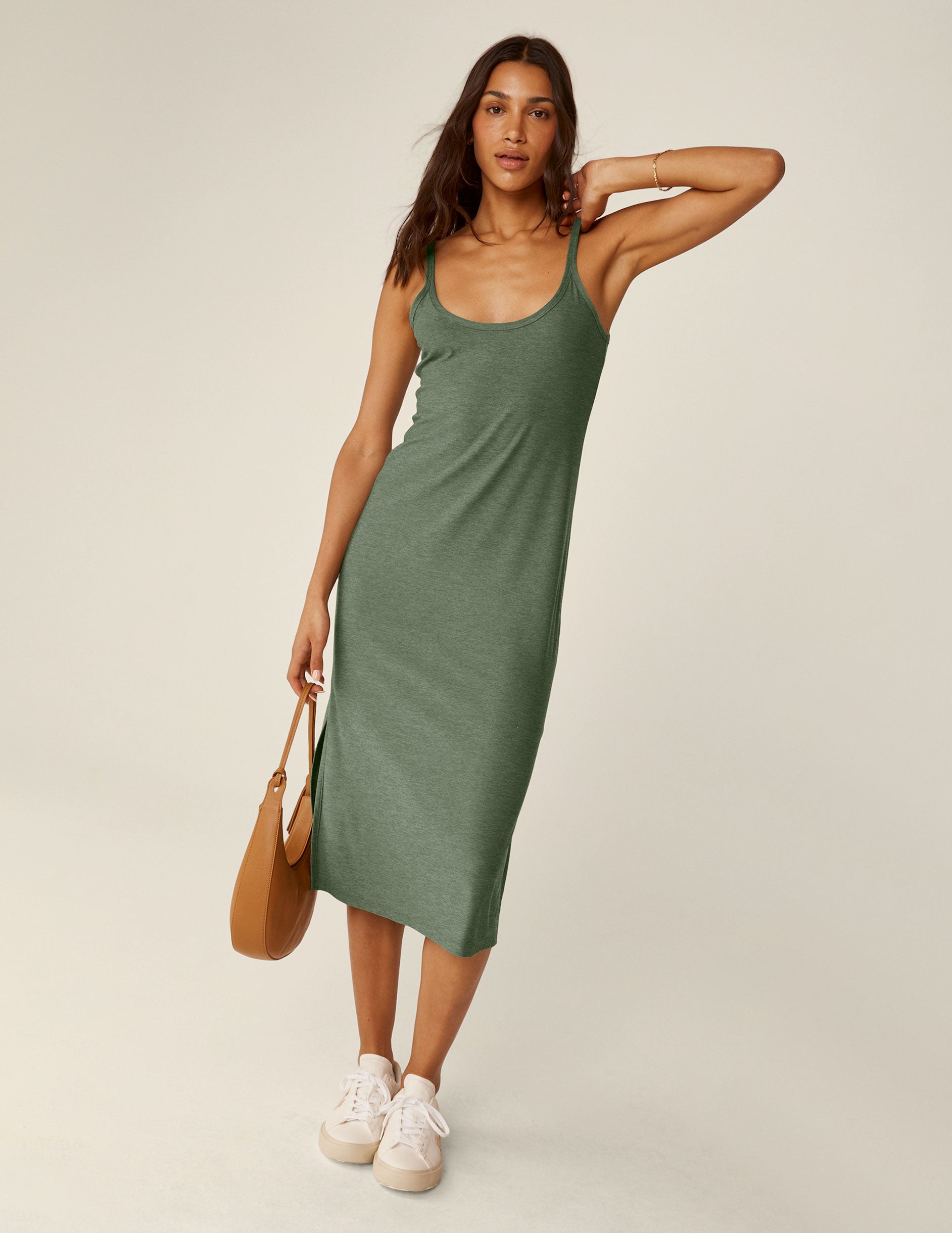 green scoop neck midi dress with slits on each side.