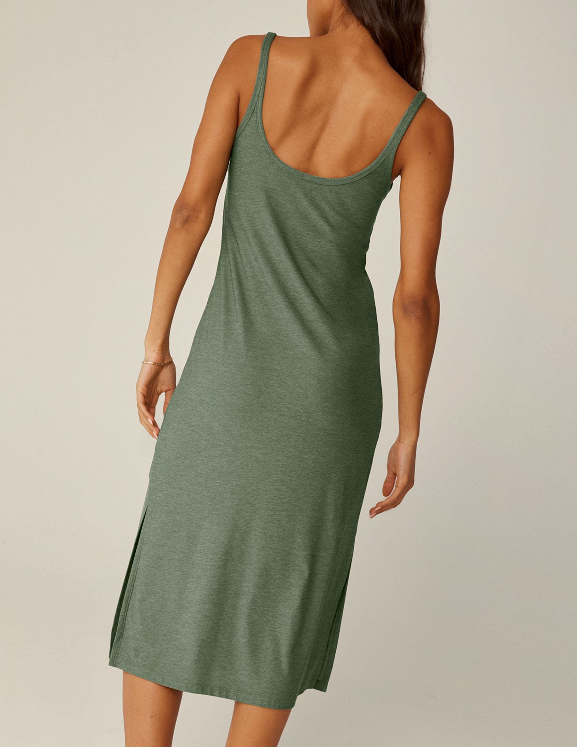 green scoop neck midi dress with slits on each side.