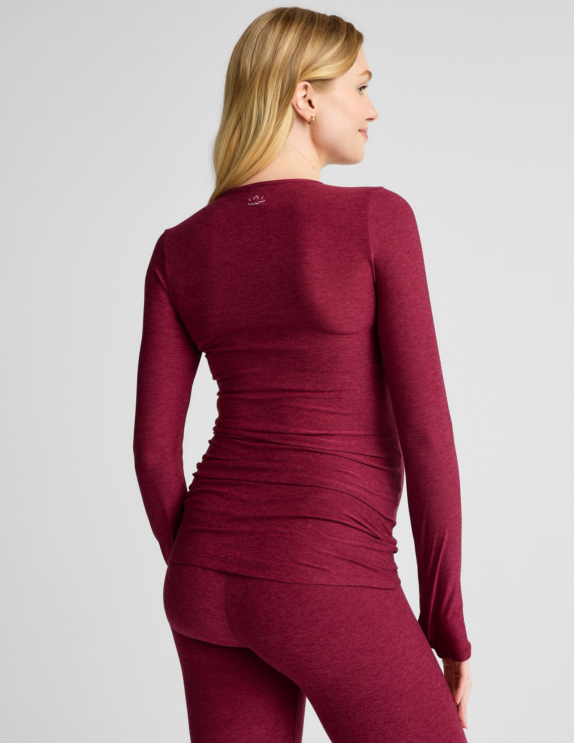 red scoop neck long sleeve maternity top with thumb holes.