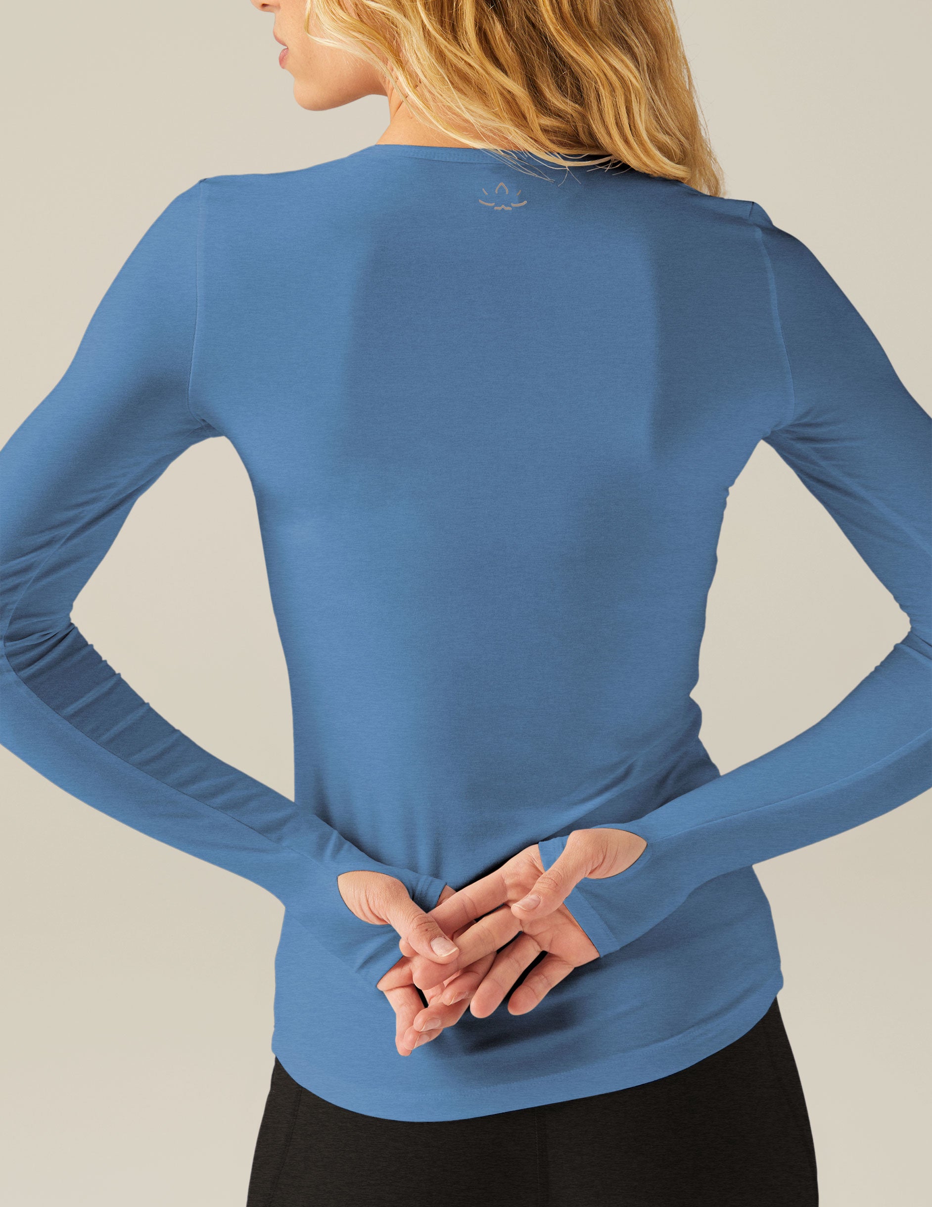 blue long sleeve top with thumb holes. 
