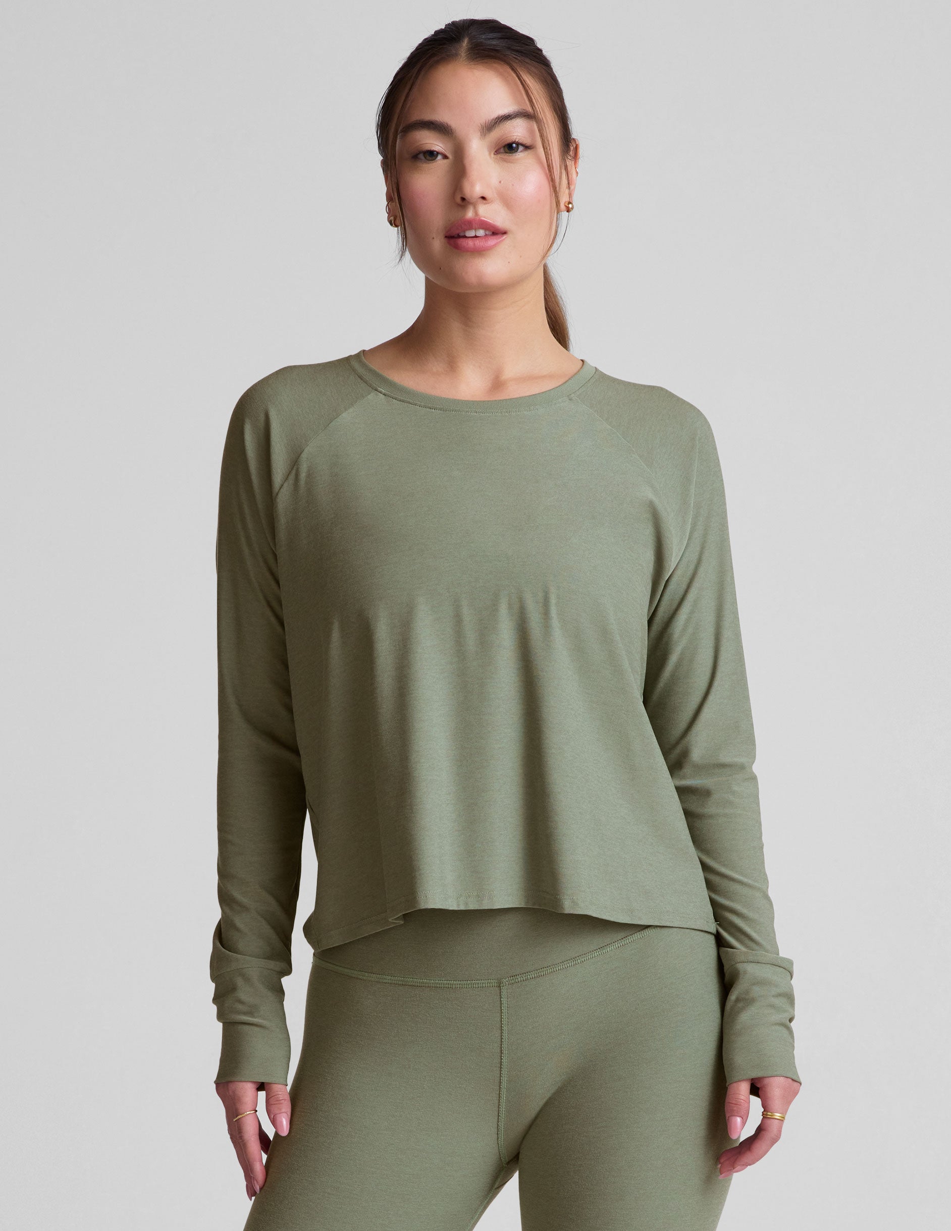 green scoop neck long sleeve relaxed fit top.