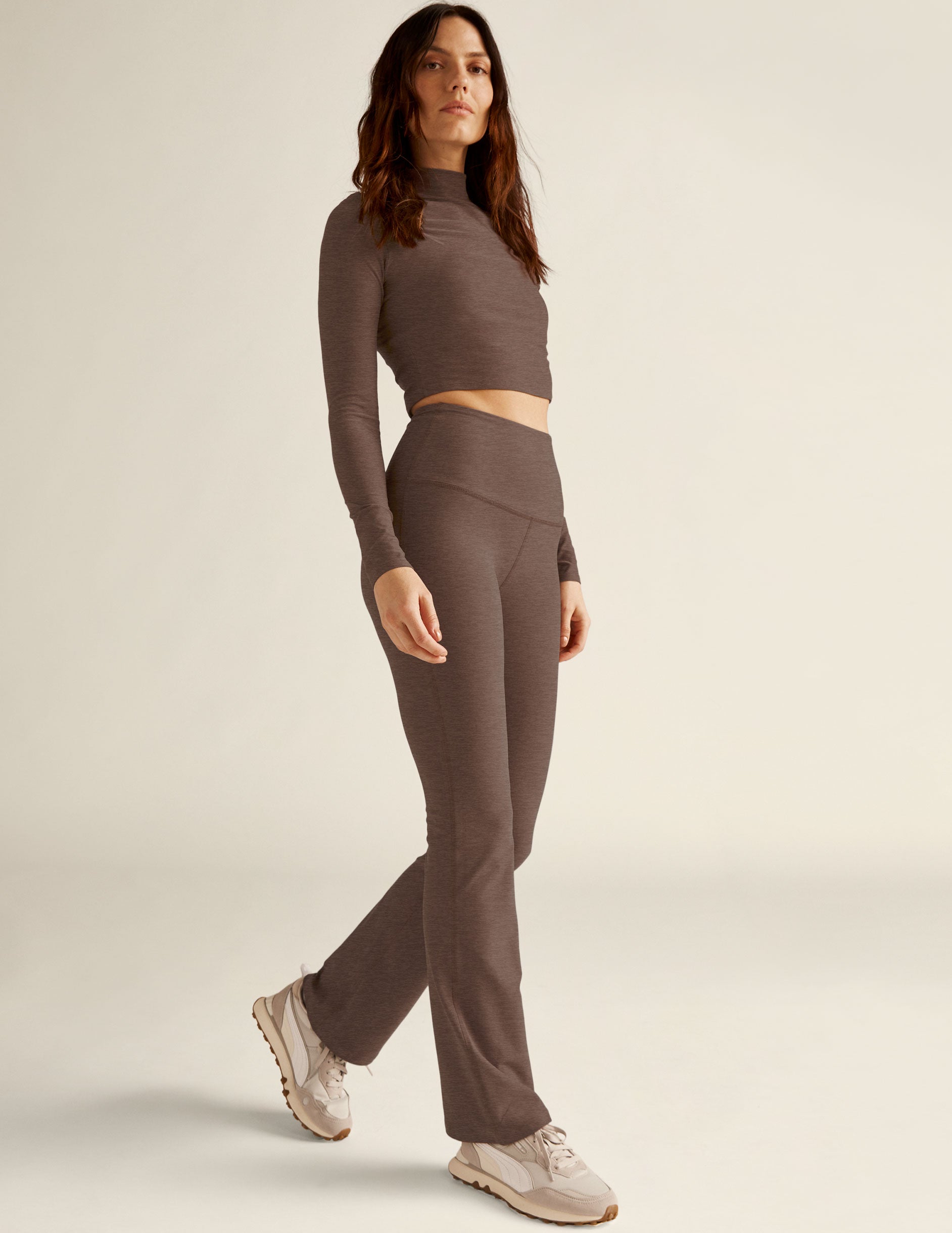 brown long sleeve mock neck cropped pullover with thumb holes. 