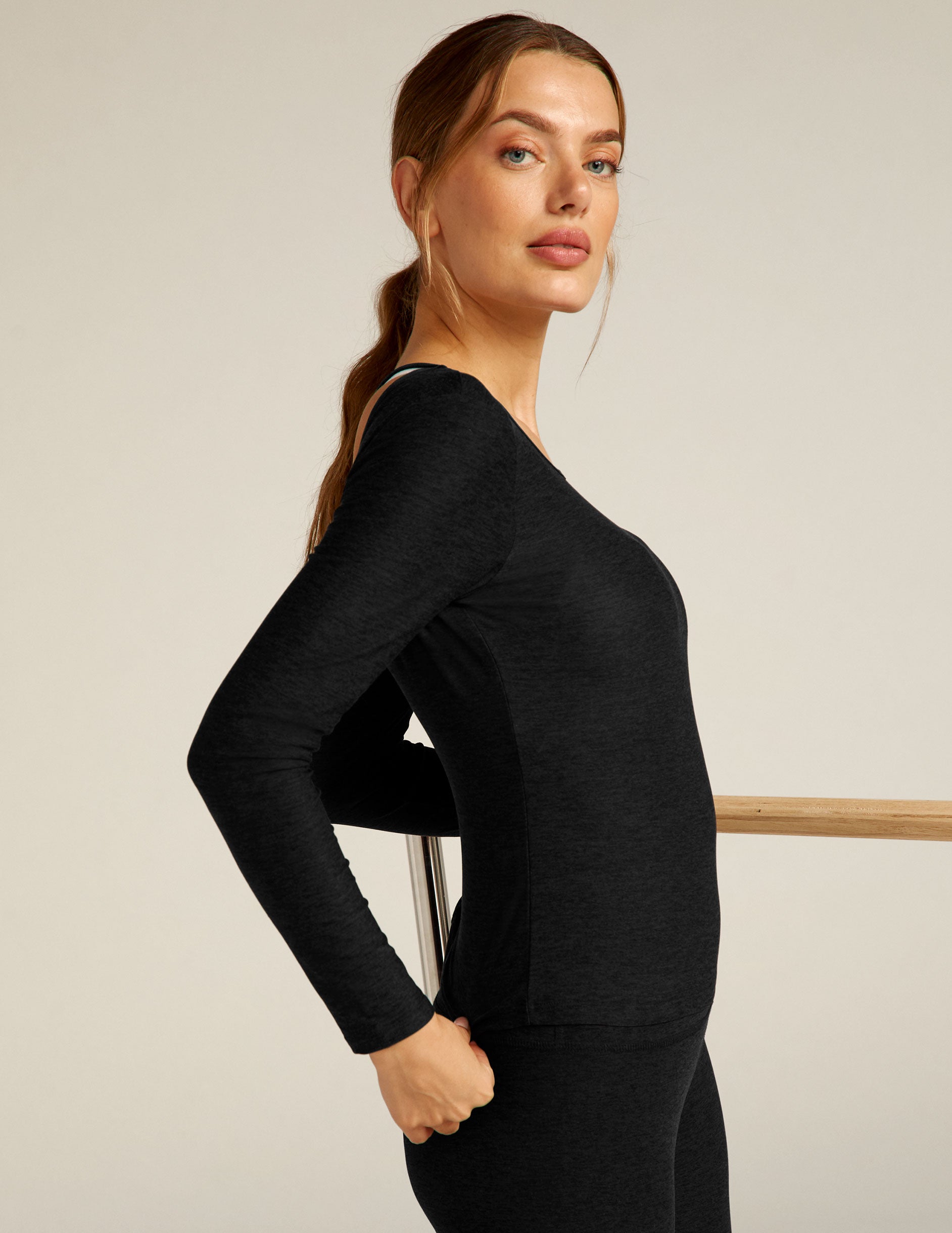 black long sleeve pullover with Open back with twisted strap detail