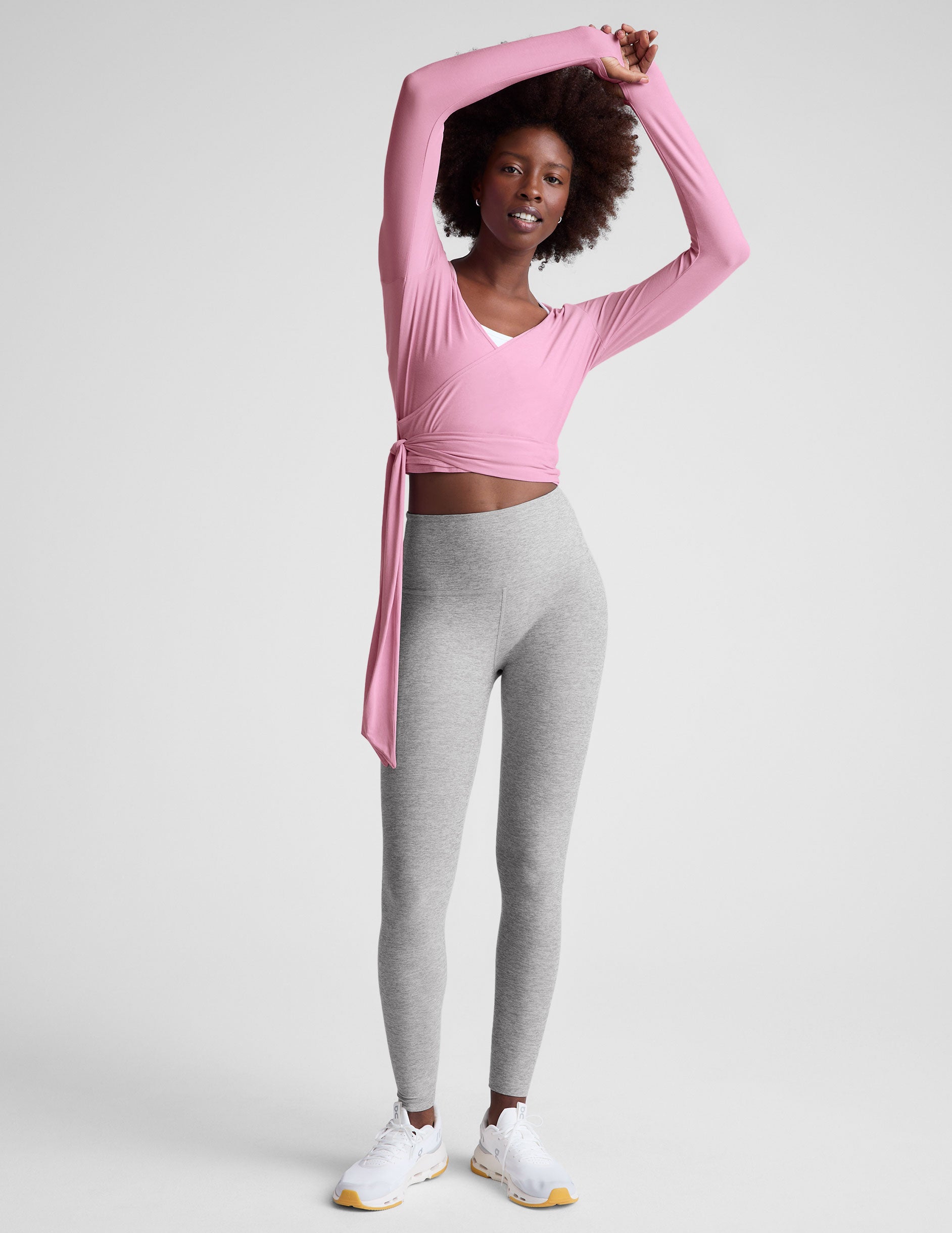 pink long sleeve wrap top with thumb holes.