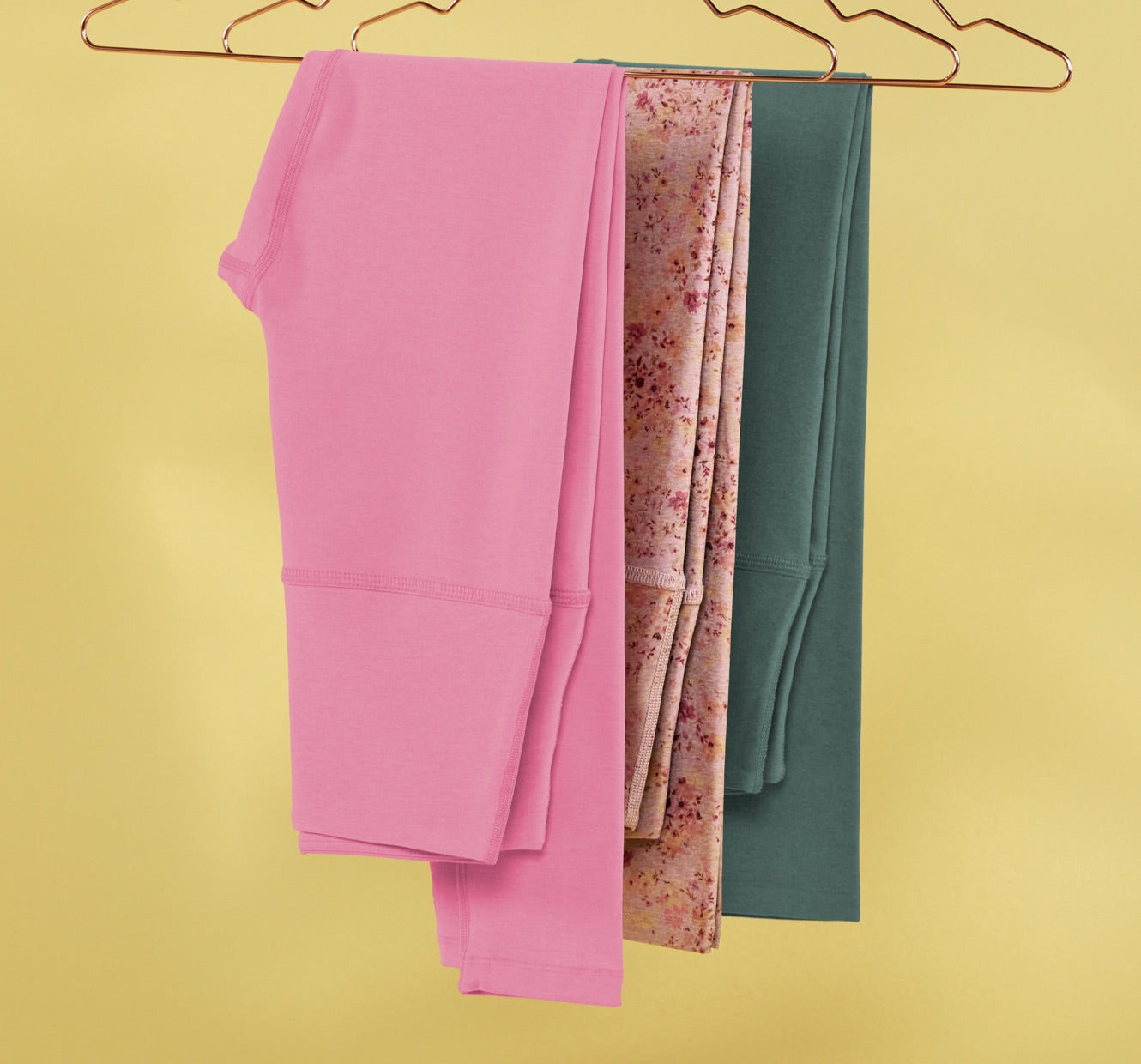pink high-waisted midi leggings, floral printed high-waisted midi leggings, green high-waisted midi leggings. 