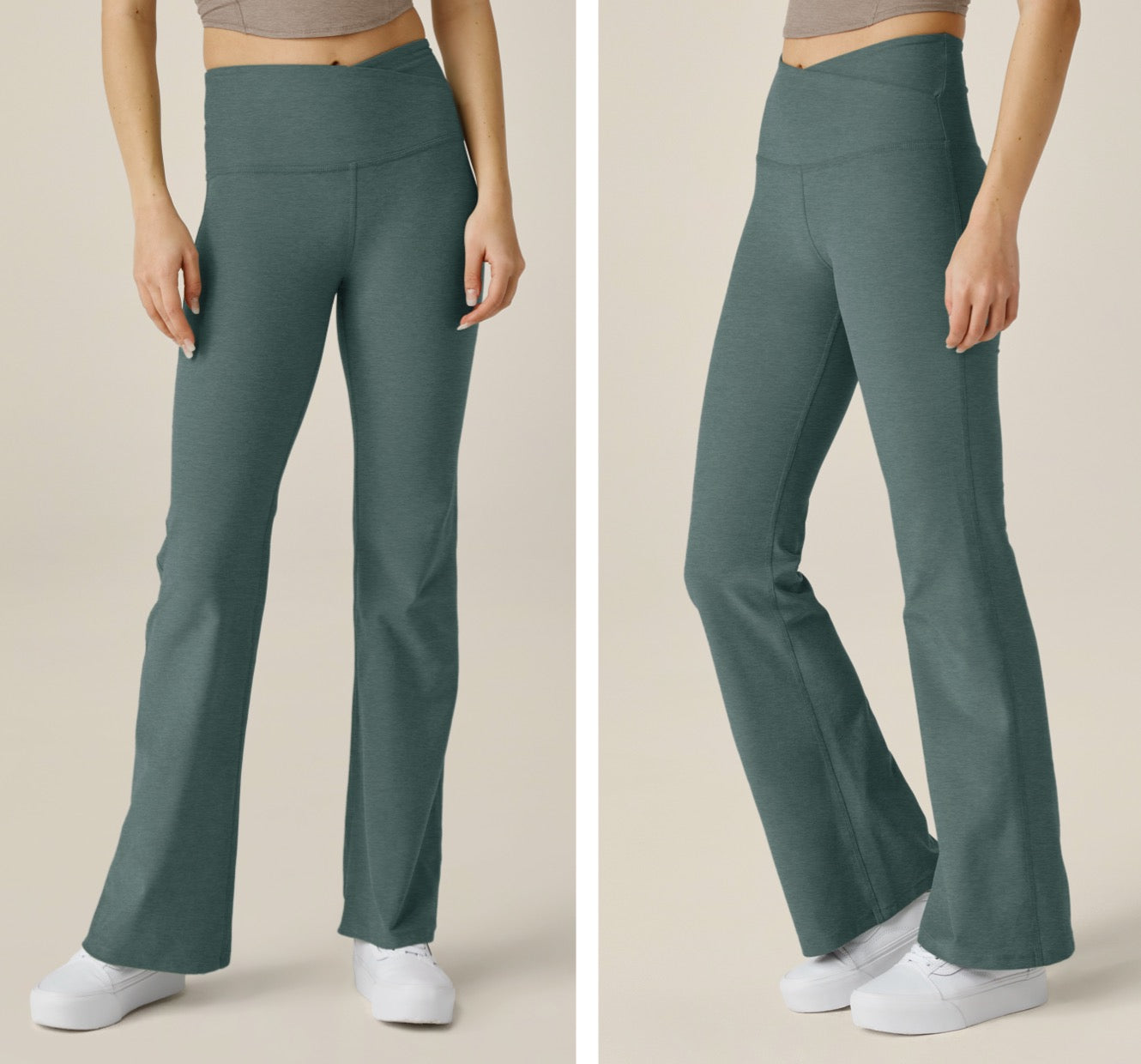 model is wearing green bootcut style athleisure pants with a crossover detailing along the front waistband. 
