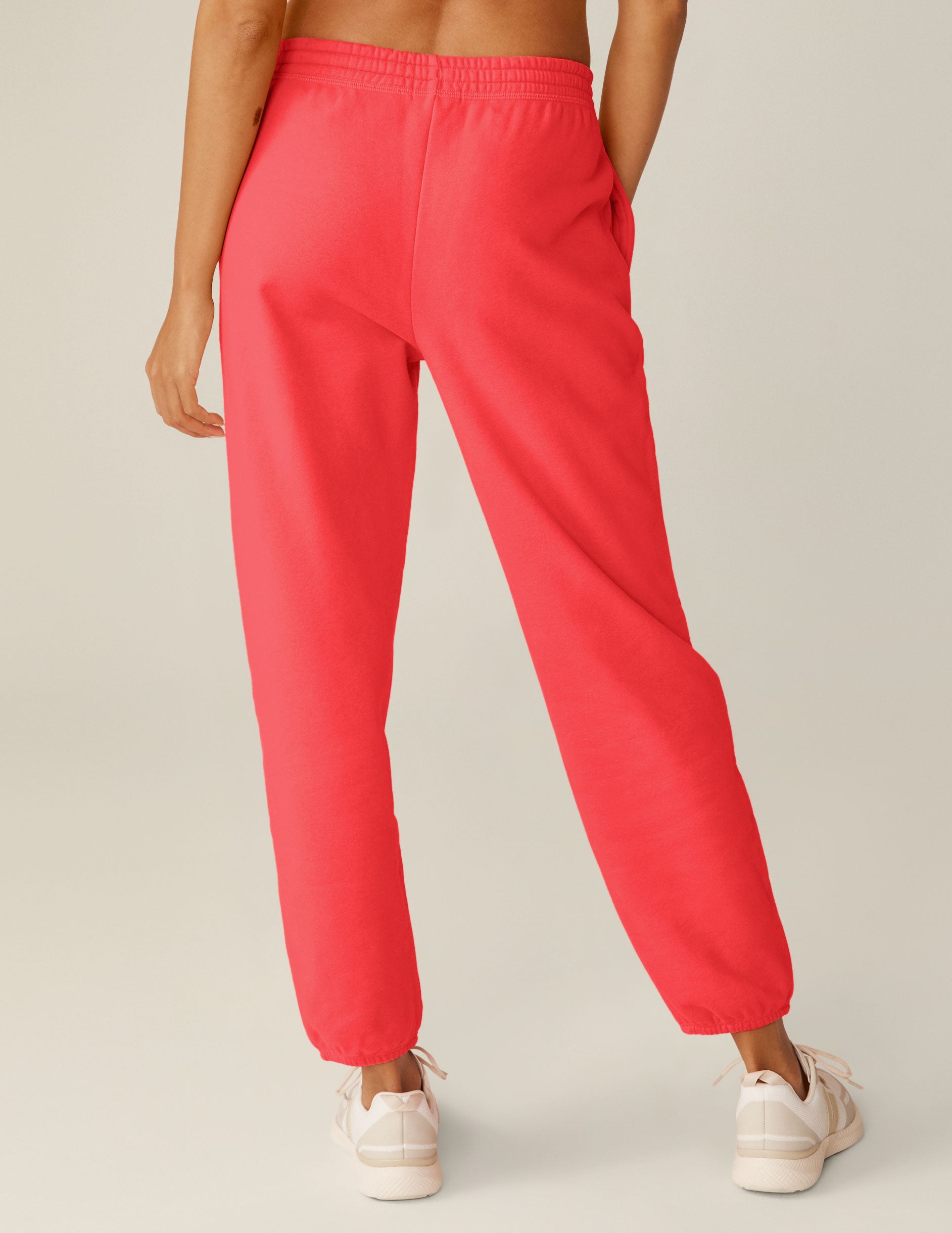 red sweatpants with a drawstring on the inner waistband. 
