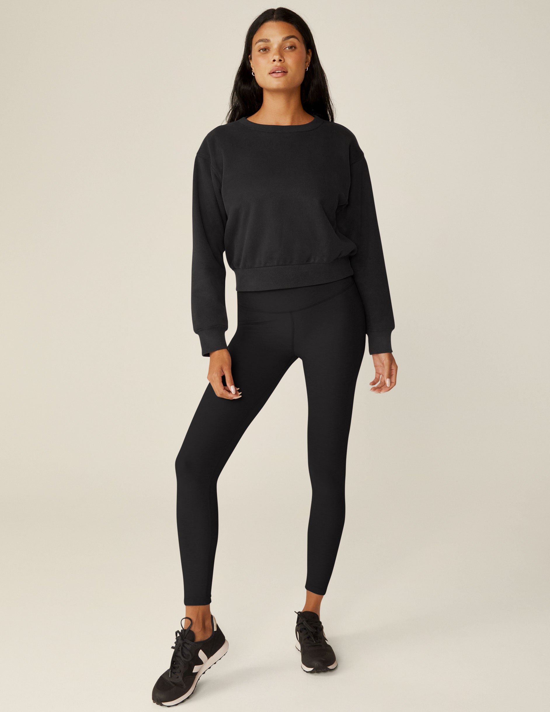 black loose-fitting classic length crew neck sweatshirt.