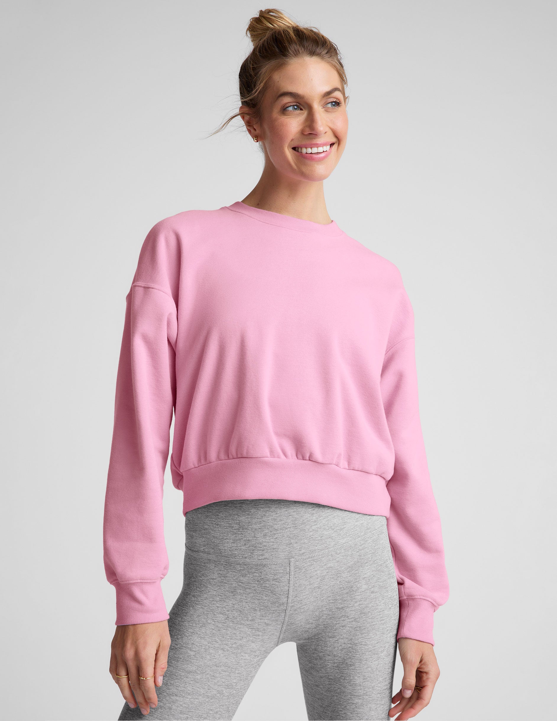 pink crew neck loose-fitting classic length sweatshirt.