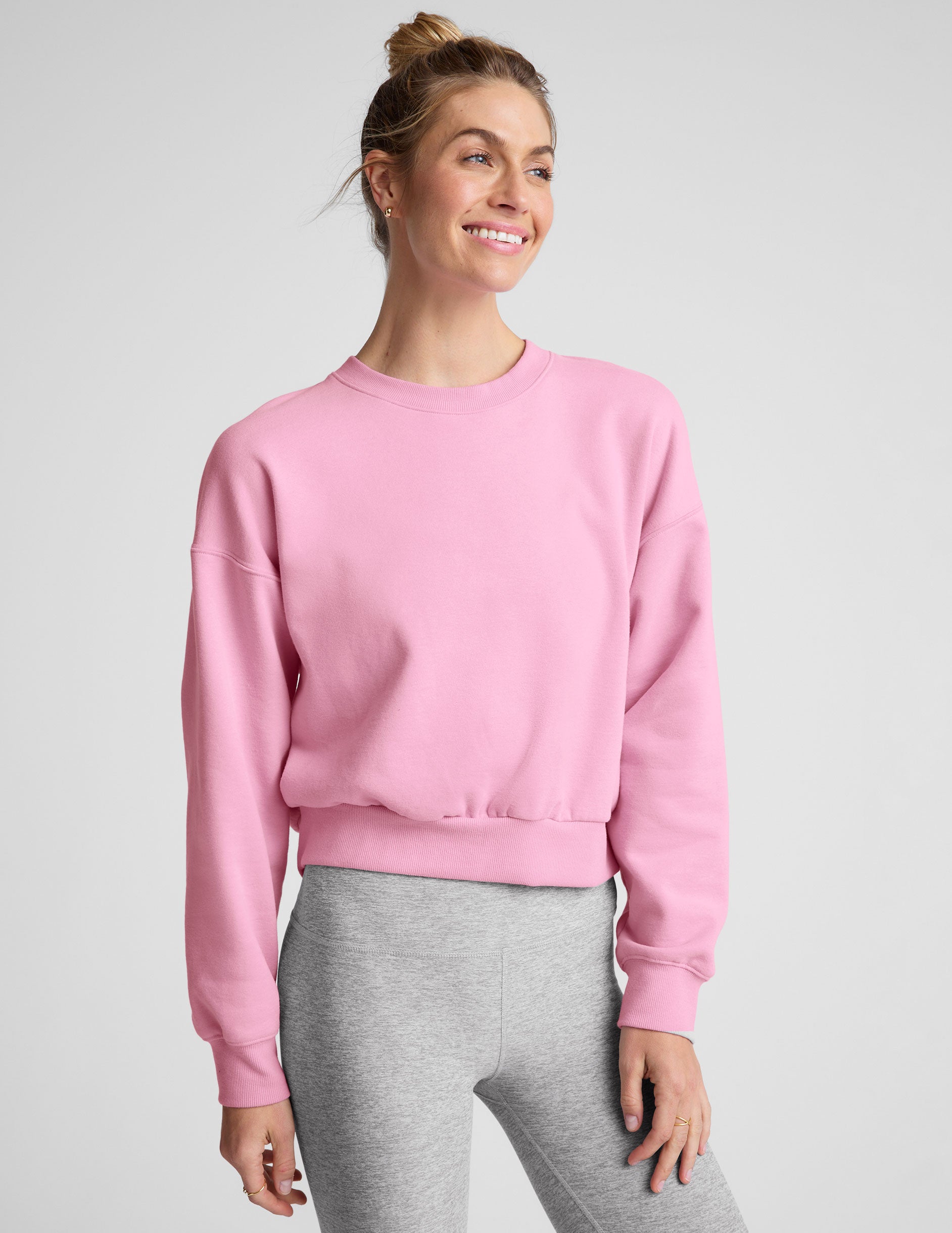 pink crew neck loose-fitting classic length sweatshirt.