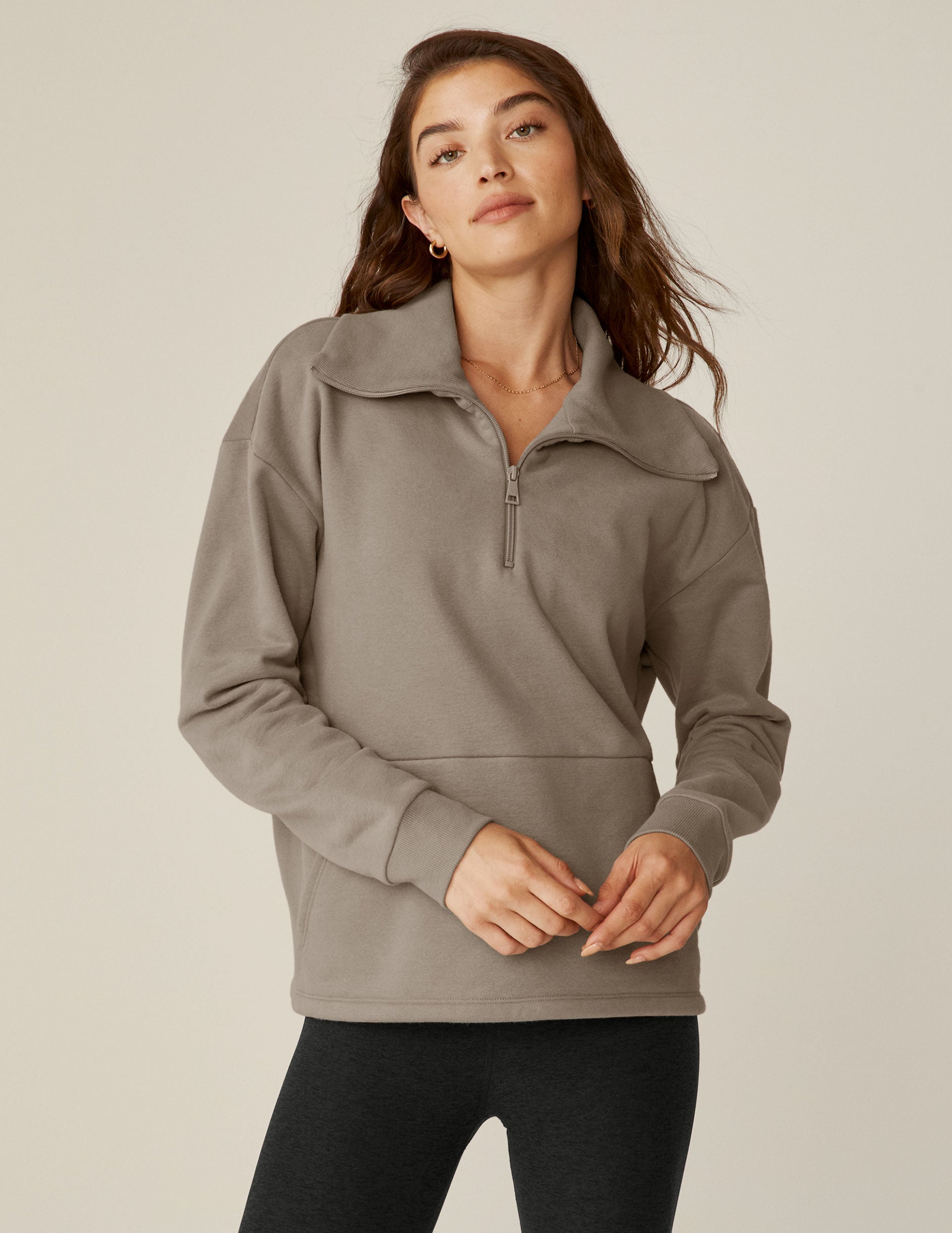 brown quarter zip pullover with a kangaroo pocket. 