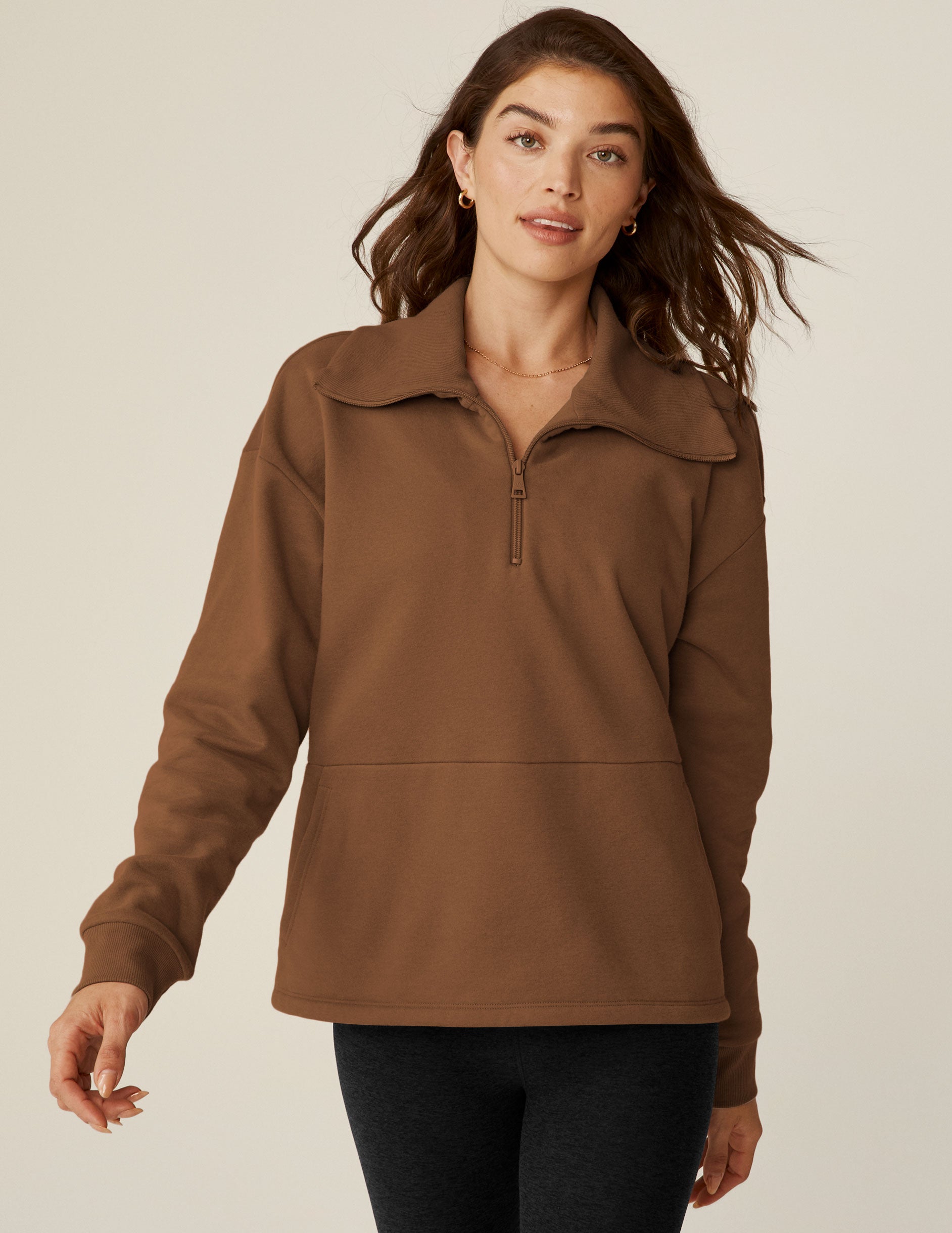 brown quarter zip pullover with kangaroo pocket. 