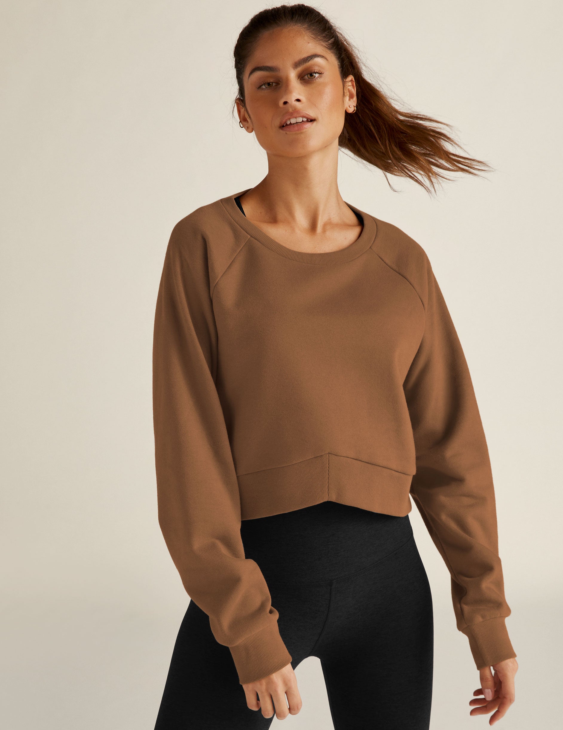 brown relaxed fit pullover sweater with a high-low center front. 