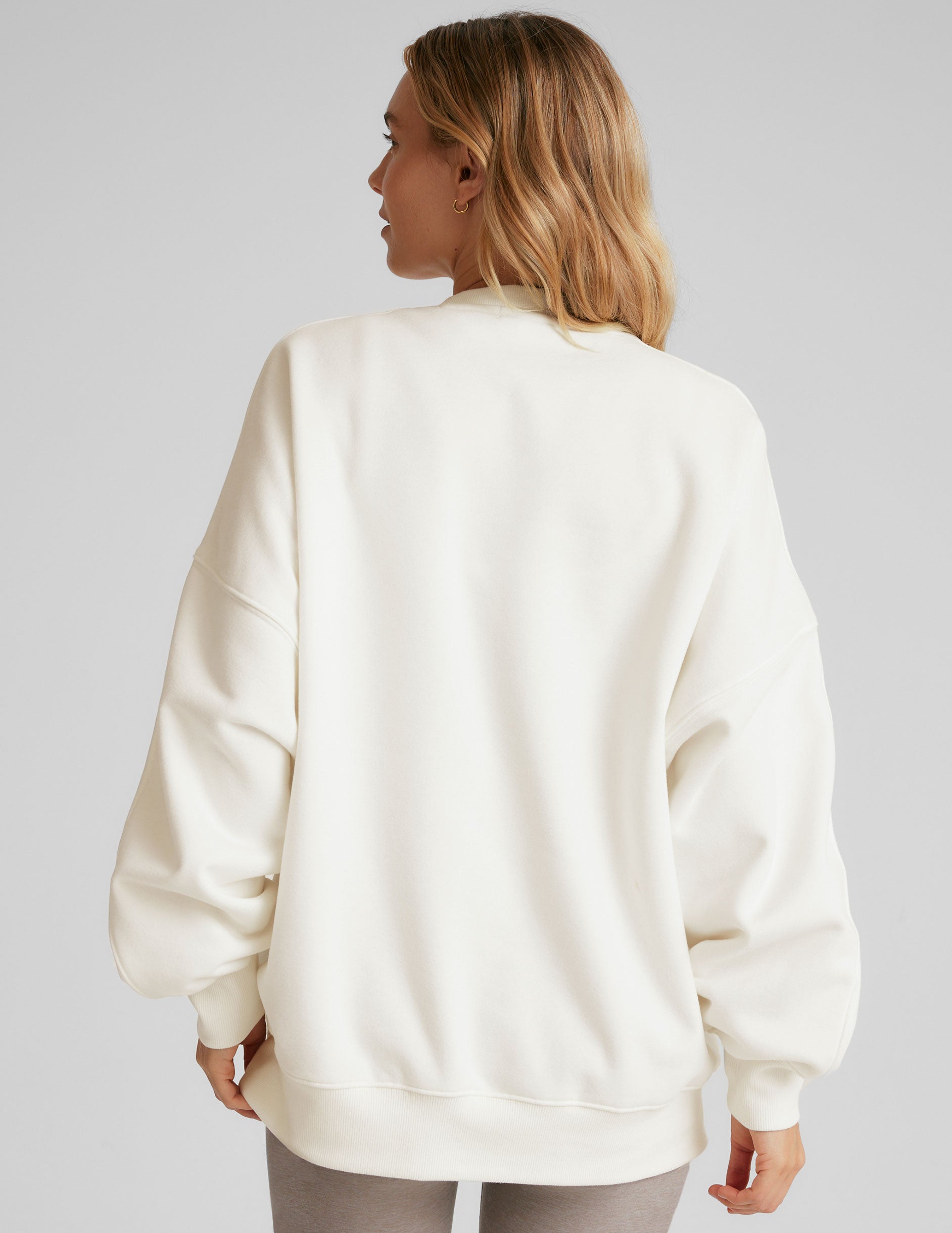 white crew neck sweatshirt.