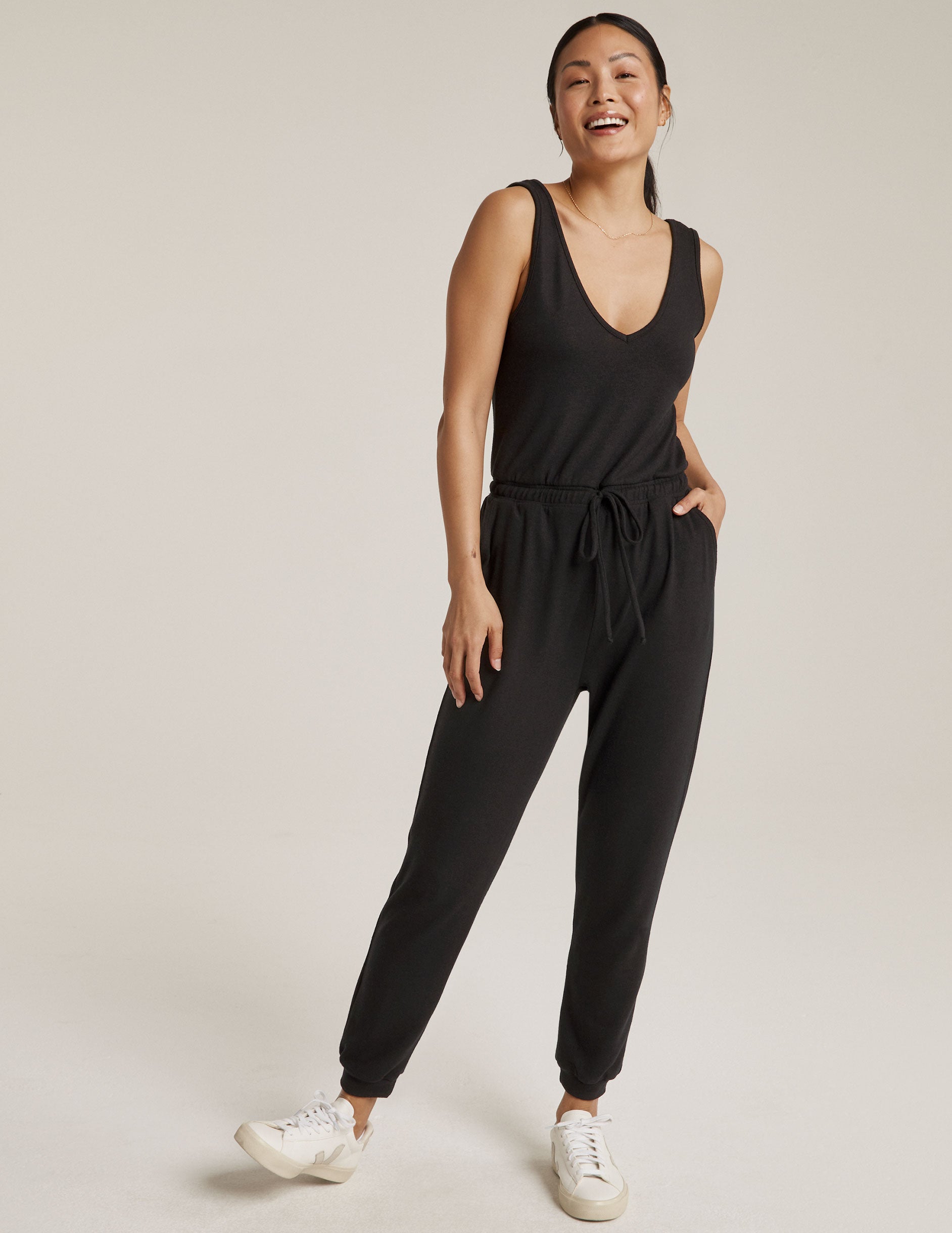 black jumpsuit with drawstring at waist