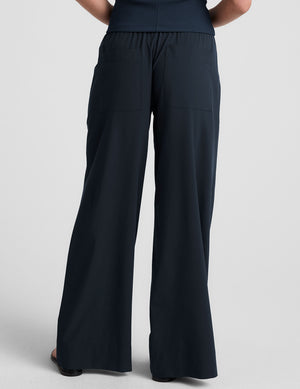 blue mid-rise wide leg pant with pockets.