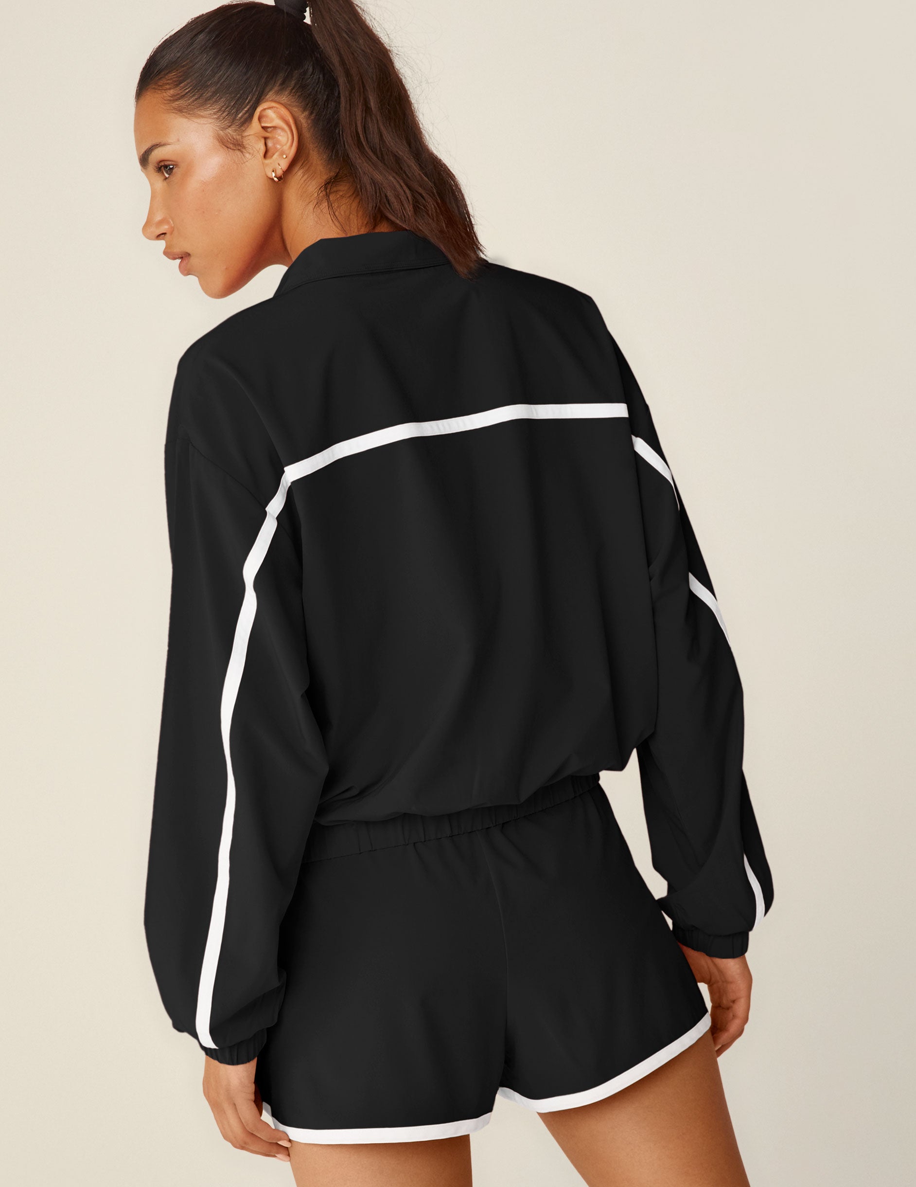 black zip-up jacket with white lining.