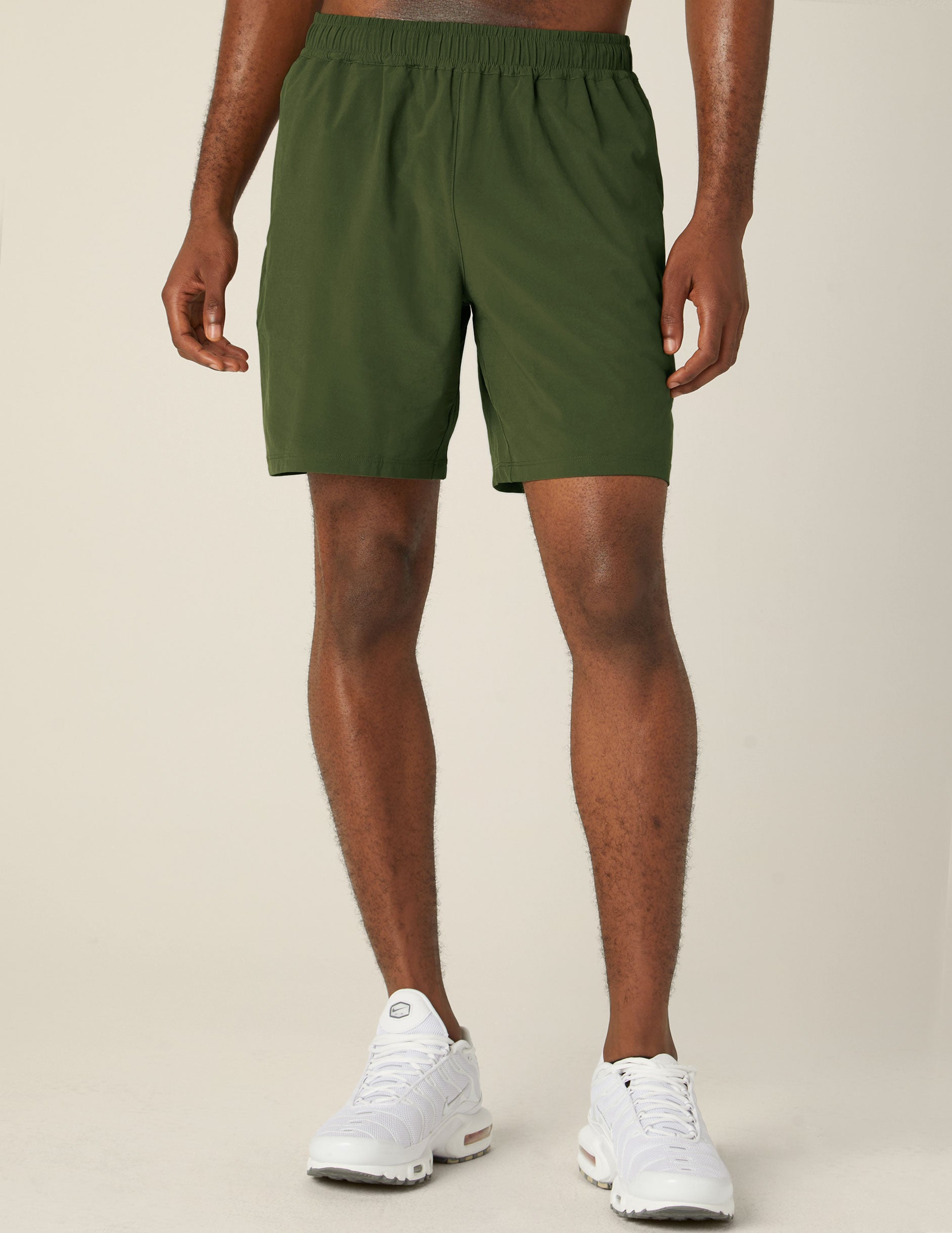 green mens shorts with back pockets.