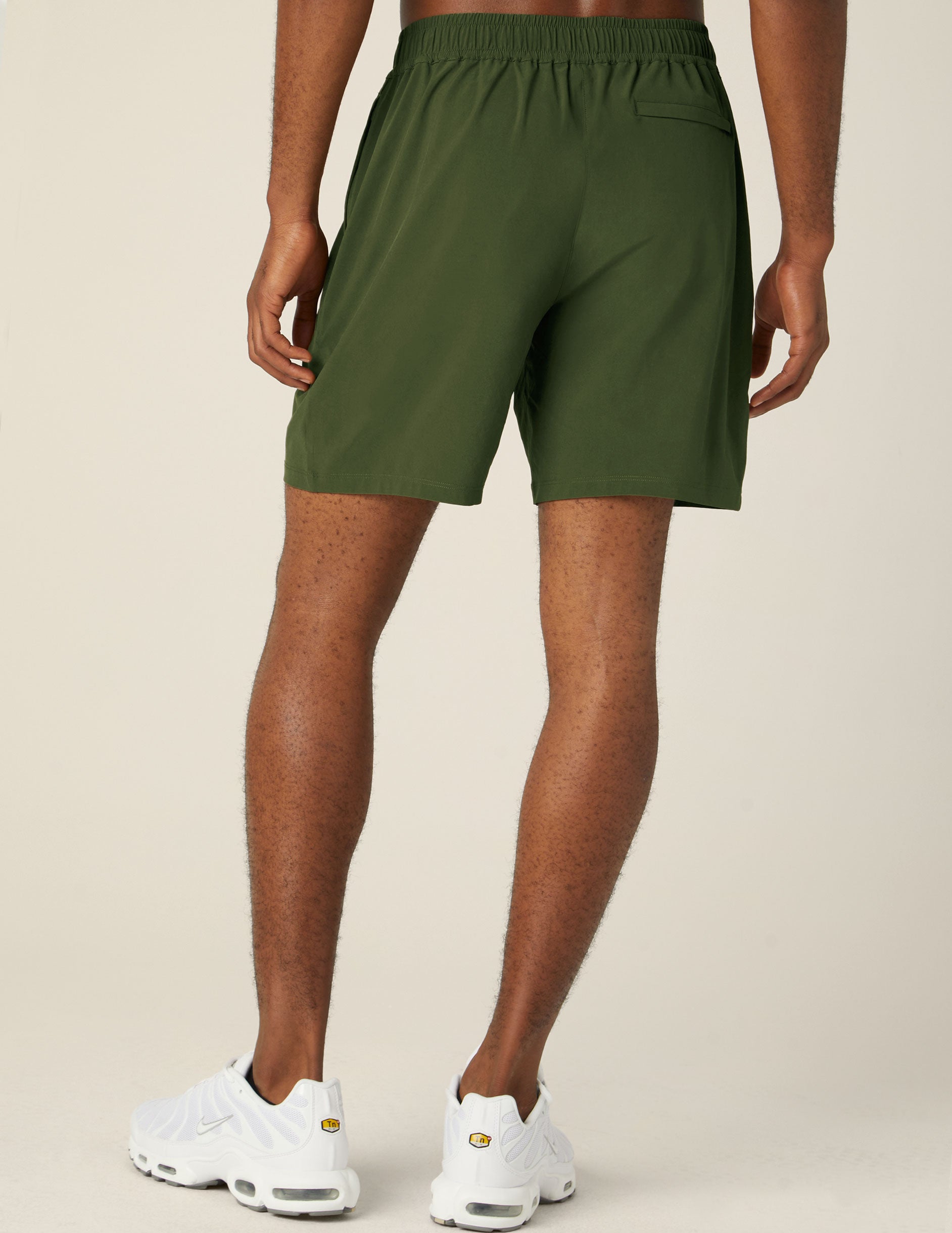 green mens shorts with back pockets.