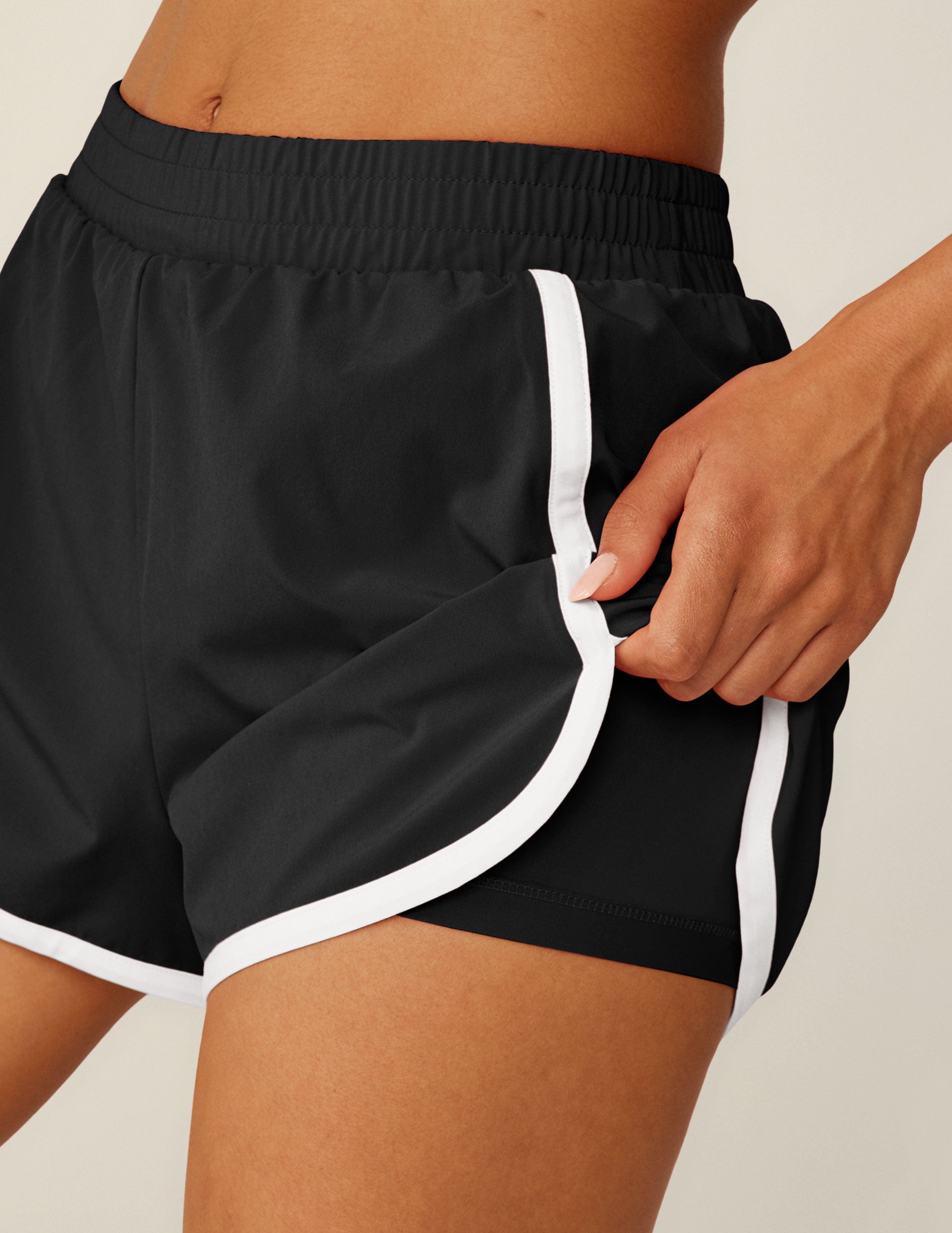 black classic length shorts with white lining. 