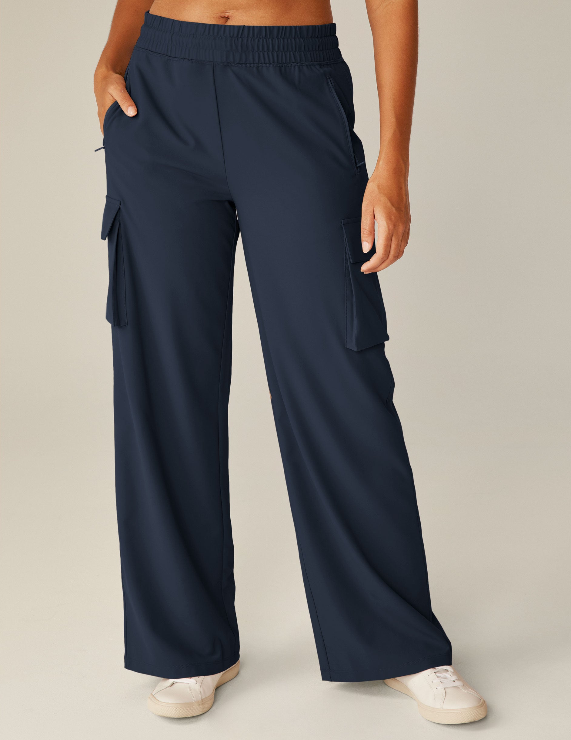 blue cargo style pants with pockets. 