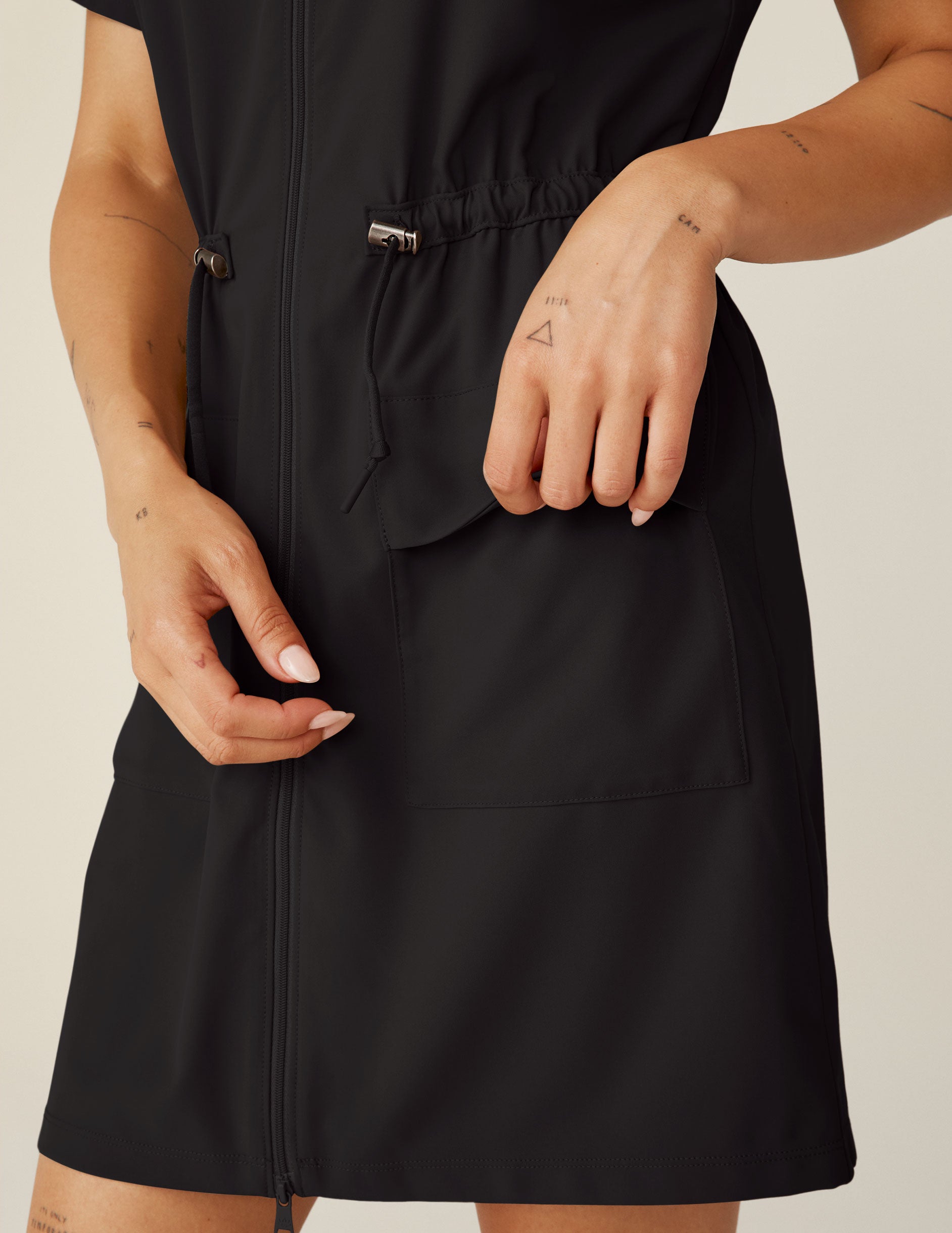 black zip-up mini cargo style dress. 