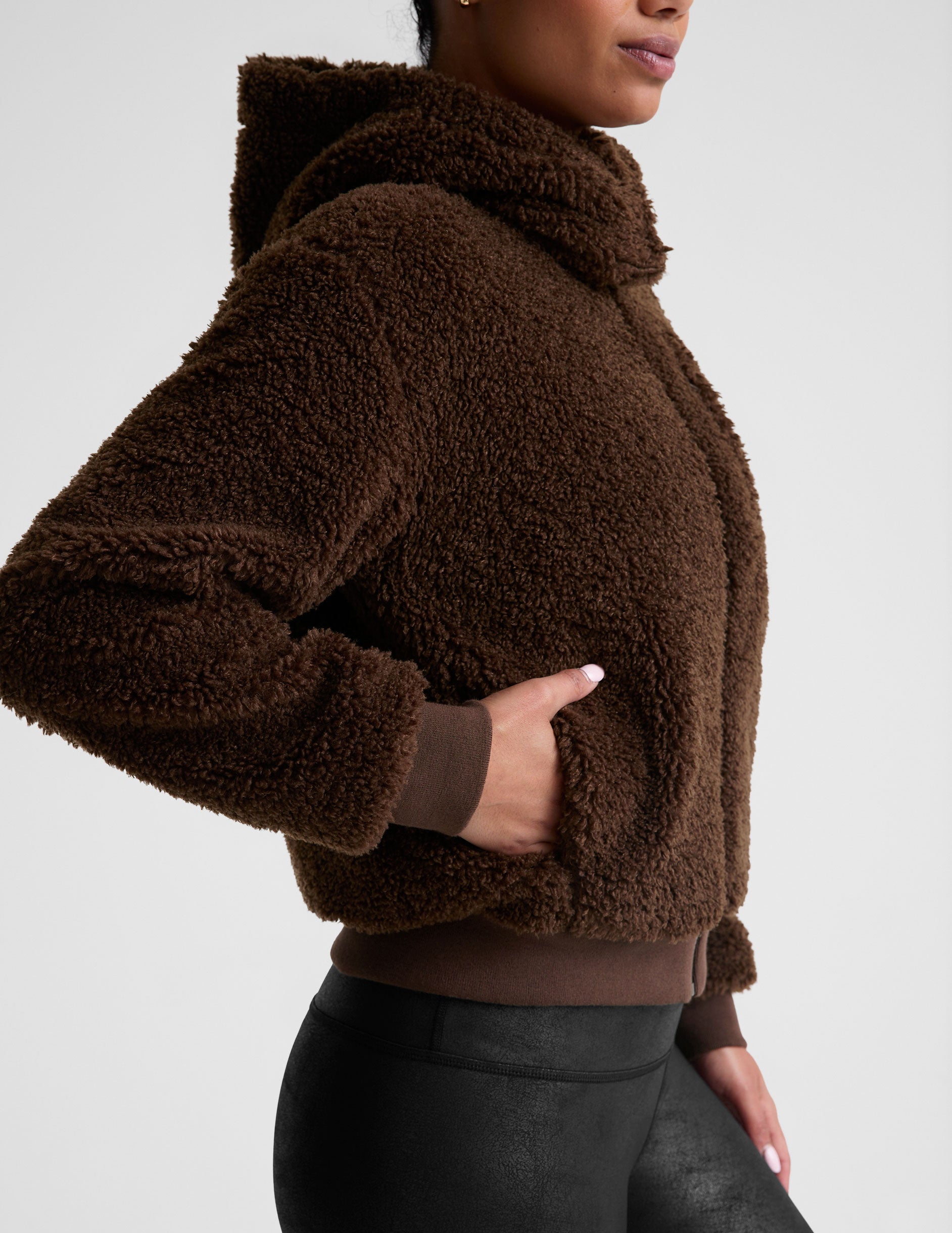 brown hooded faux sherpa jacket with pockets.